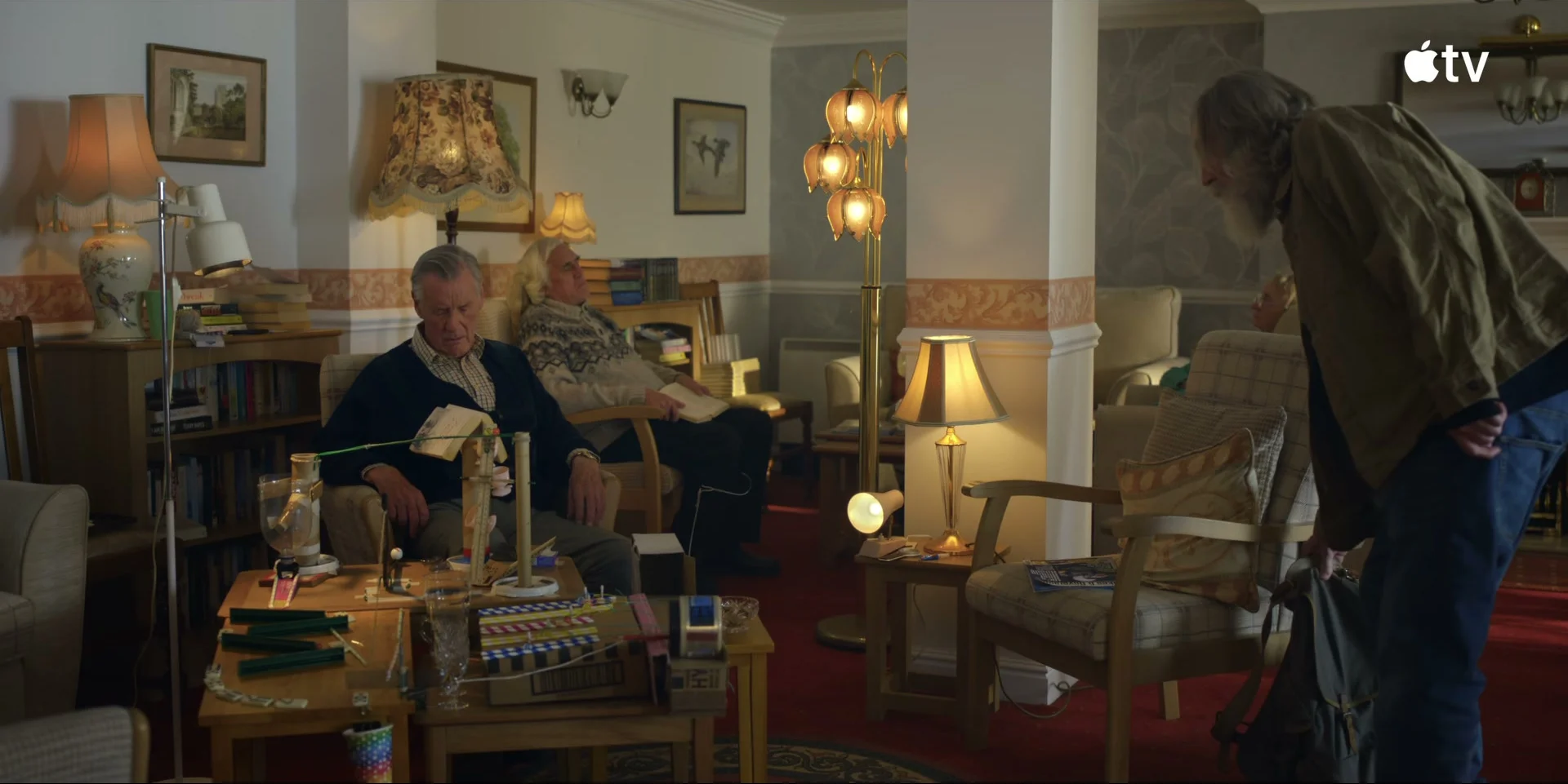 Pearce Quigley and Michael Palin sit in a living room as Michael and Brian.