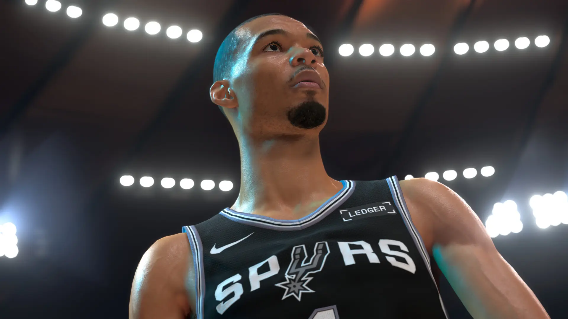 Victor Wembanyama looks up under bright arena lights in NBA 2K27.