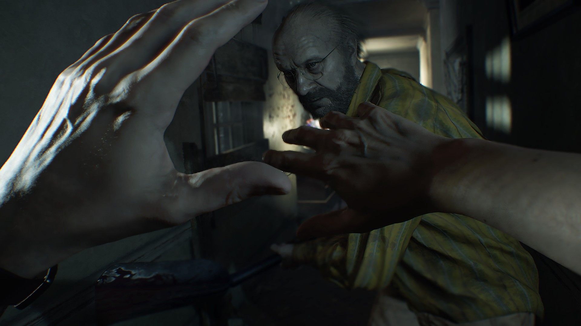 Ethan raises his arms while a threatening figure closes in.