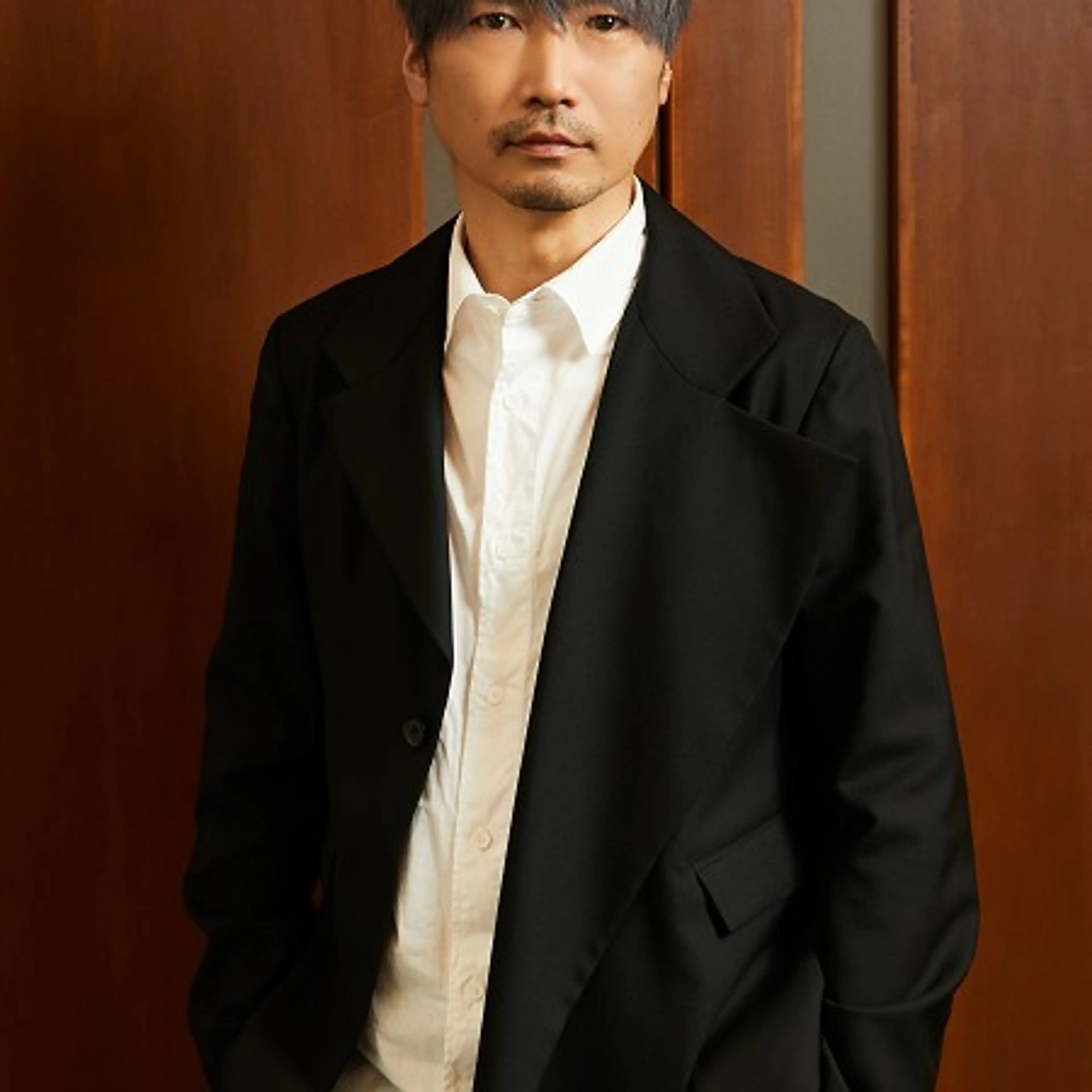 Japanese voice actor Katsuyuki Konishi in an official Ken Production portrait.