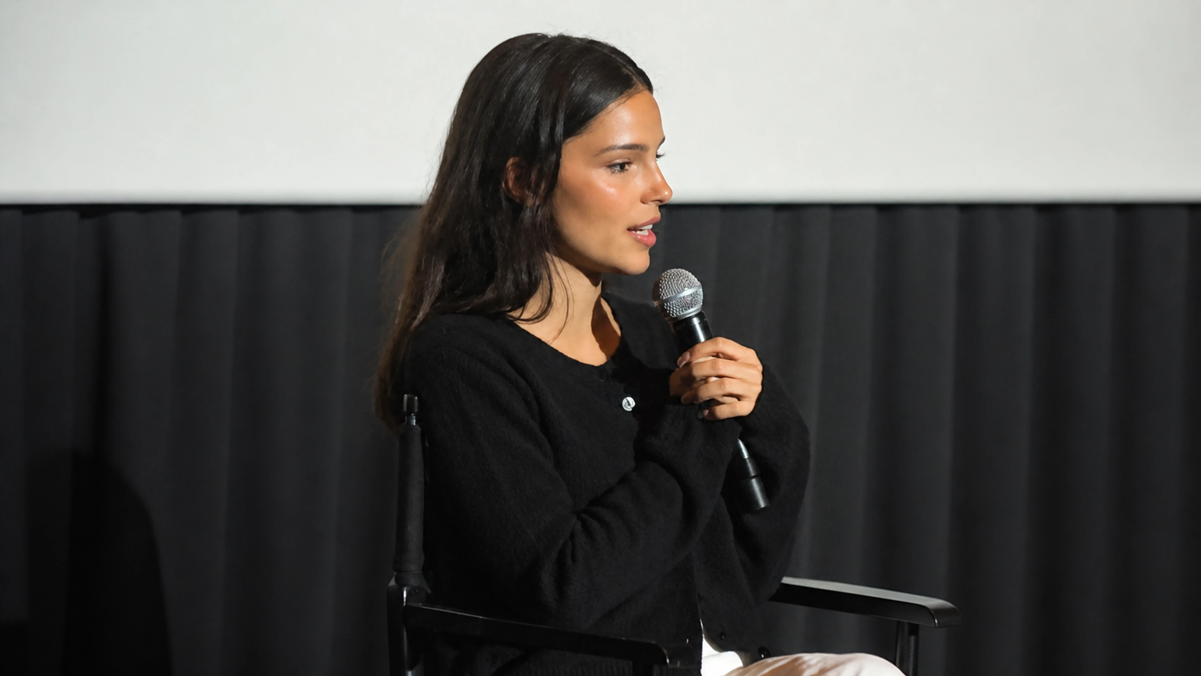 Inde Navarrette speaks into a microphone in a horizontal portrait from the 2026 Obsession Q&A.