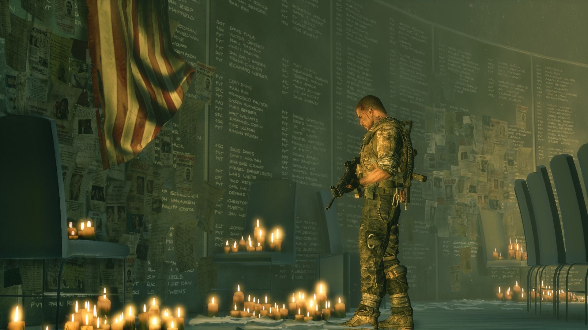 Soldiers pass a memorial wall in the damaged city.