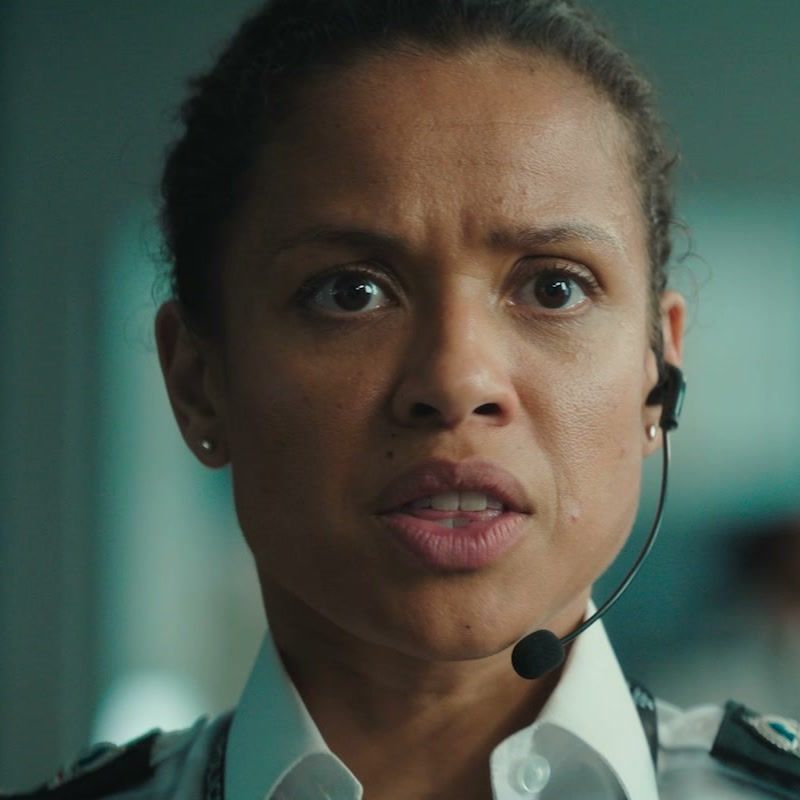 Gugu Mbatha-Raw as Zuzana in Fuze, with her face visible and a headset on.