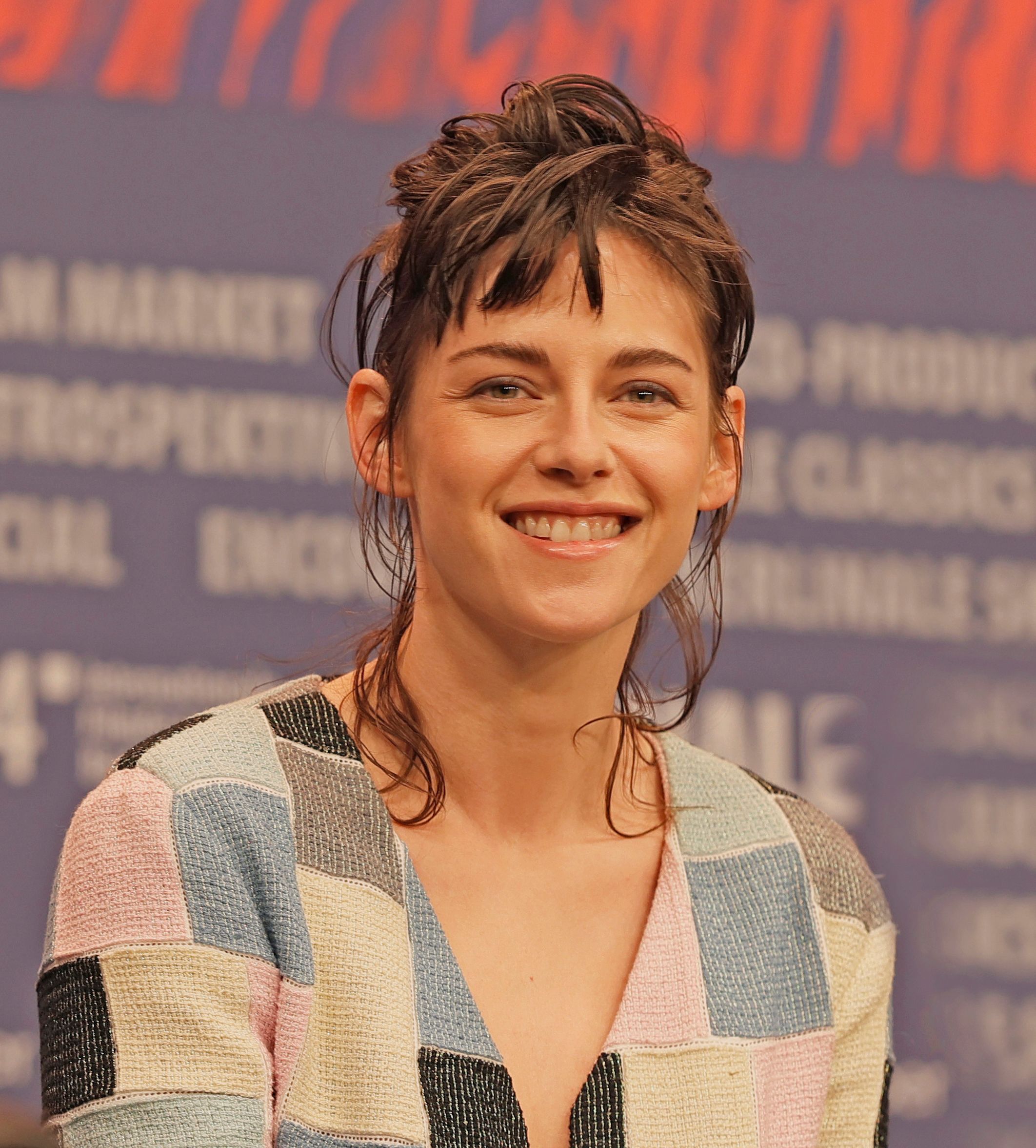 Kristen Stewart smiles at a 2024 Berlin Film Festival event.