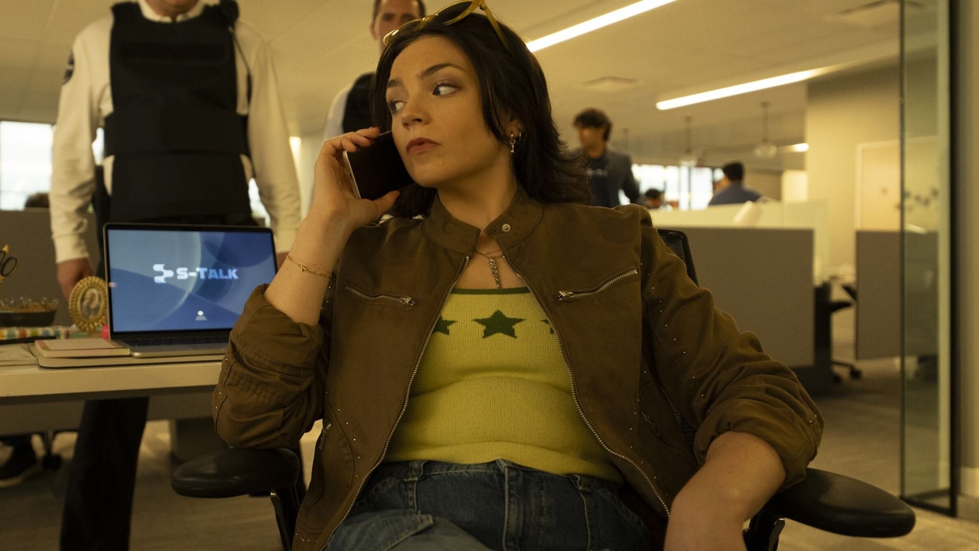 Ella Stiller as Christy Palladino, speaking on a phone in an official Cupertino production photograph.