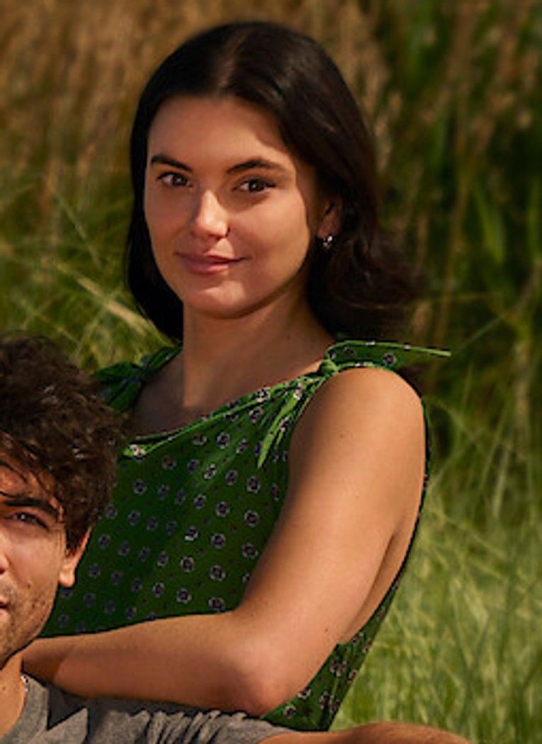 Francesca Reale in a green dress in the official This Summer Will Be Different cast photo.