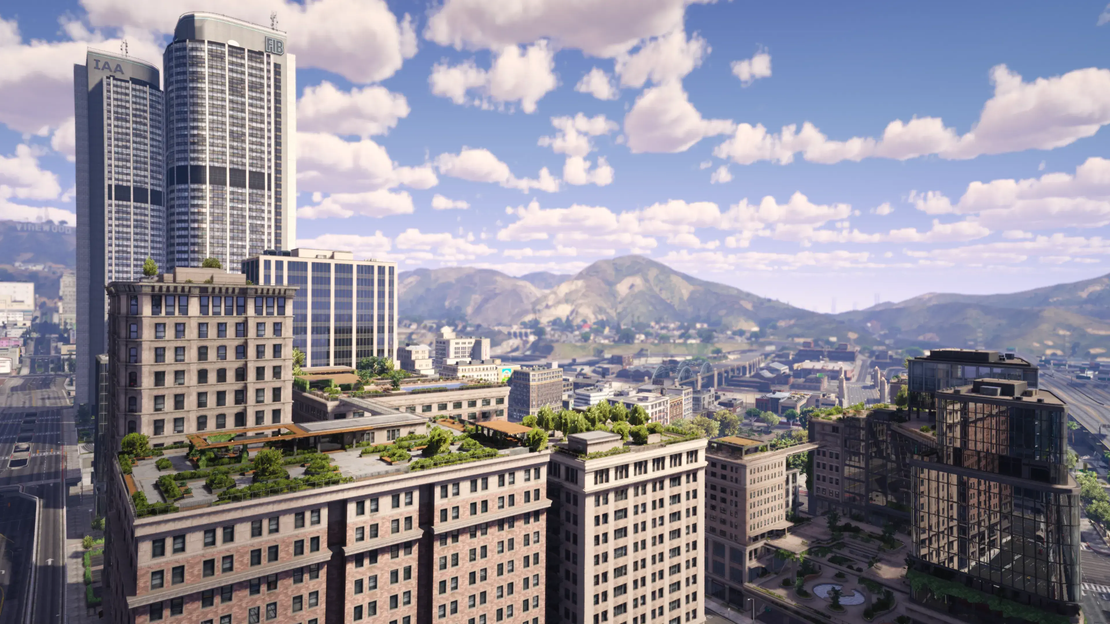 An aerial view shows new apartment and business buildings surrounding Legion Park in NoPixel V Downtown.