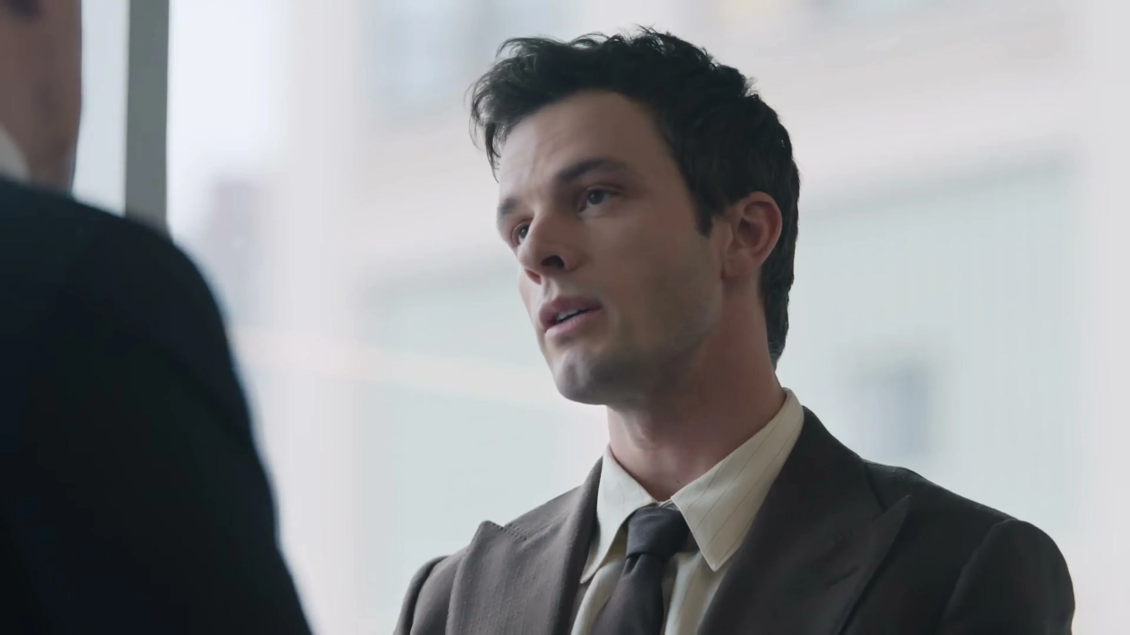 Charlie Barnett appears in a suit during a tense scene in Line of Fire.