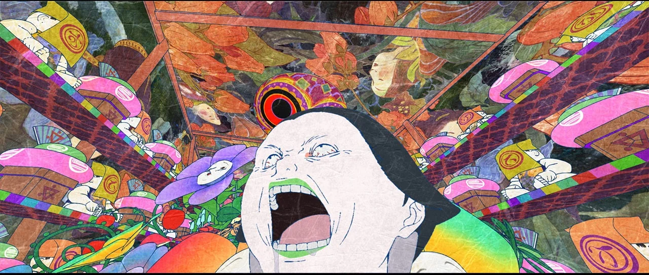 Suikoin looks upward inside a room filled with colorful patterns.