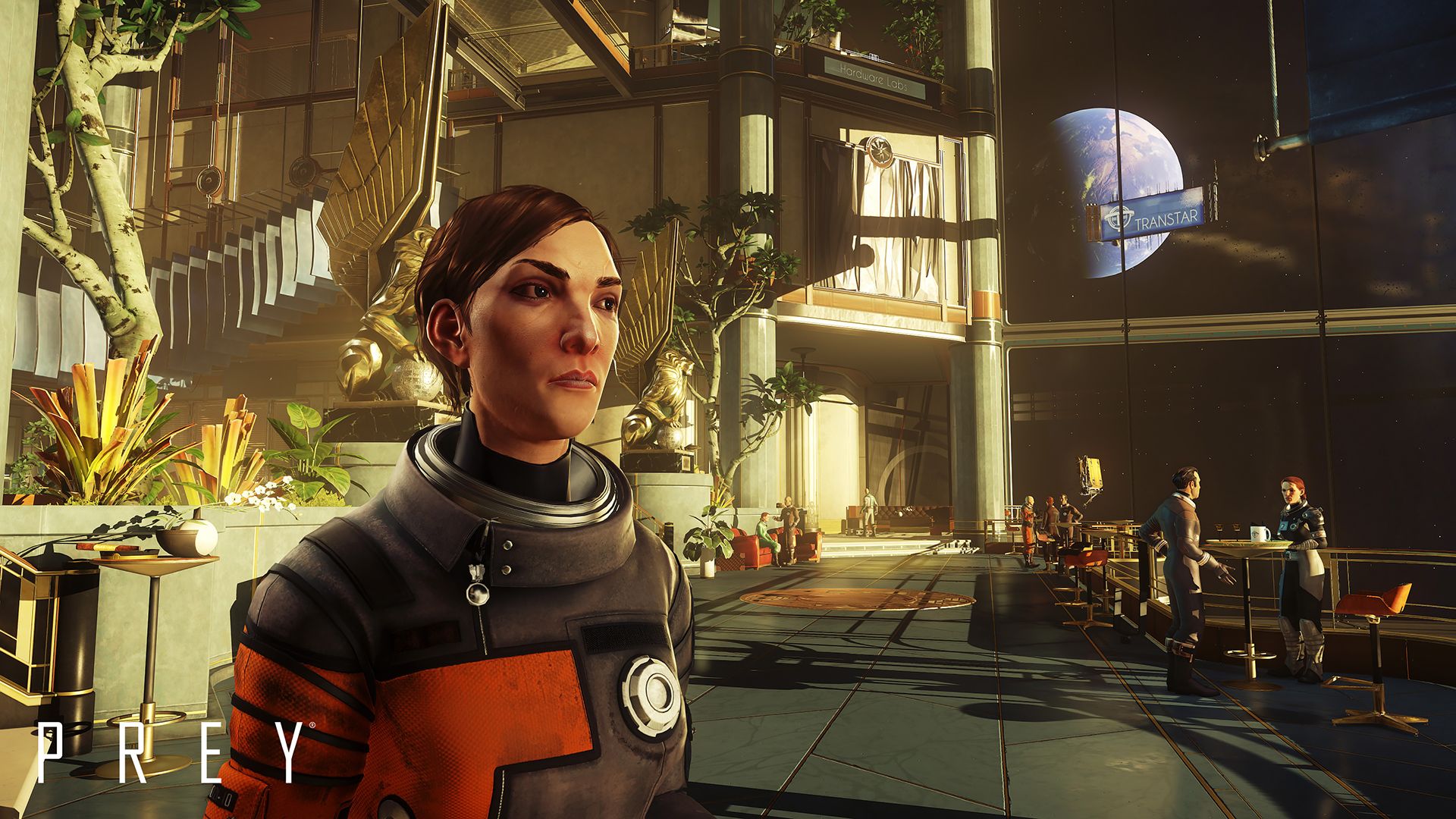 Morgan Yu stands inside a bright room with large station windows.
