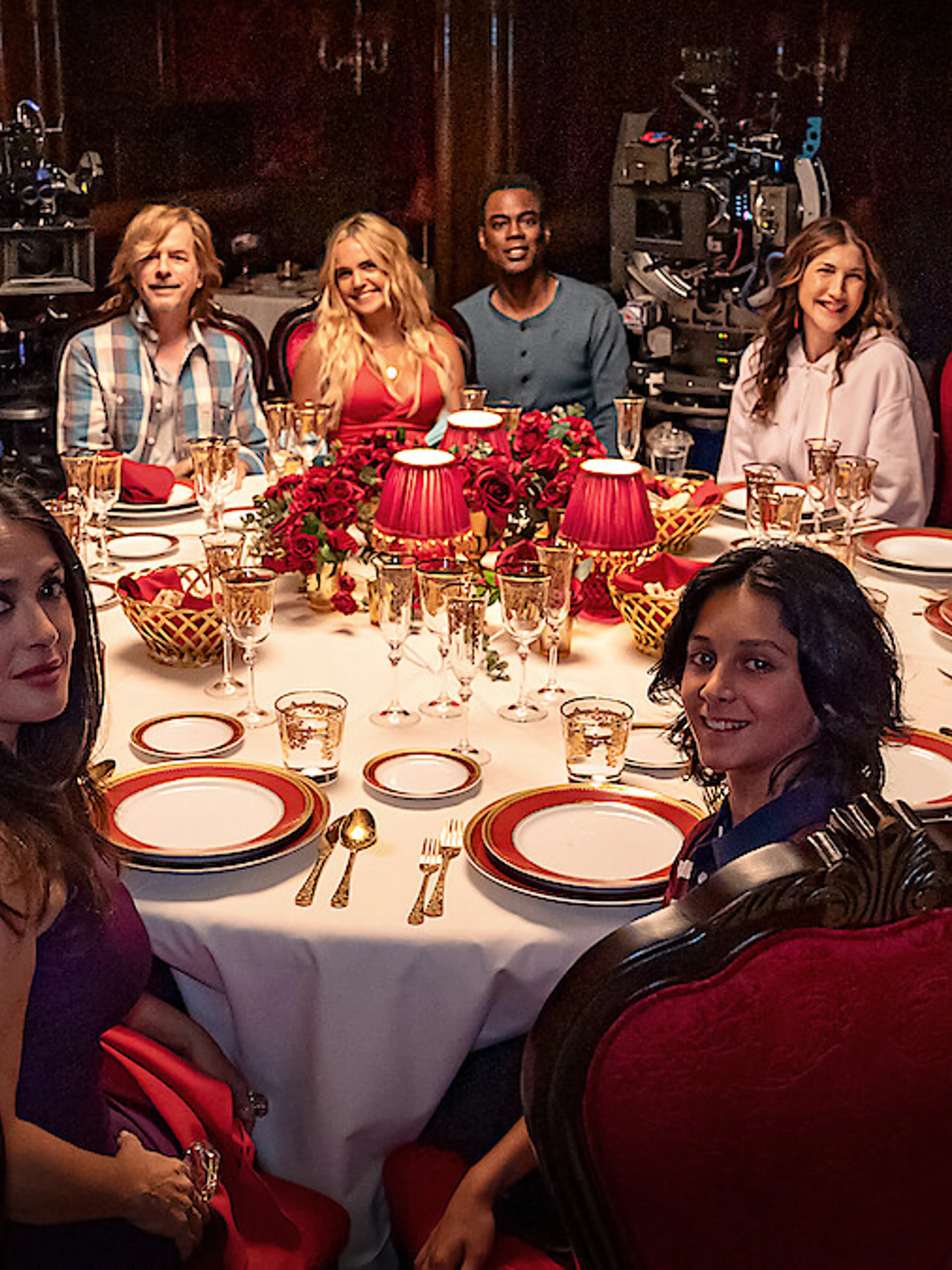 Adam Sandler and the Grown Ups 3 ensemble sit around a dinner table during production.