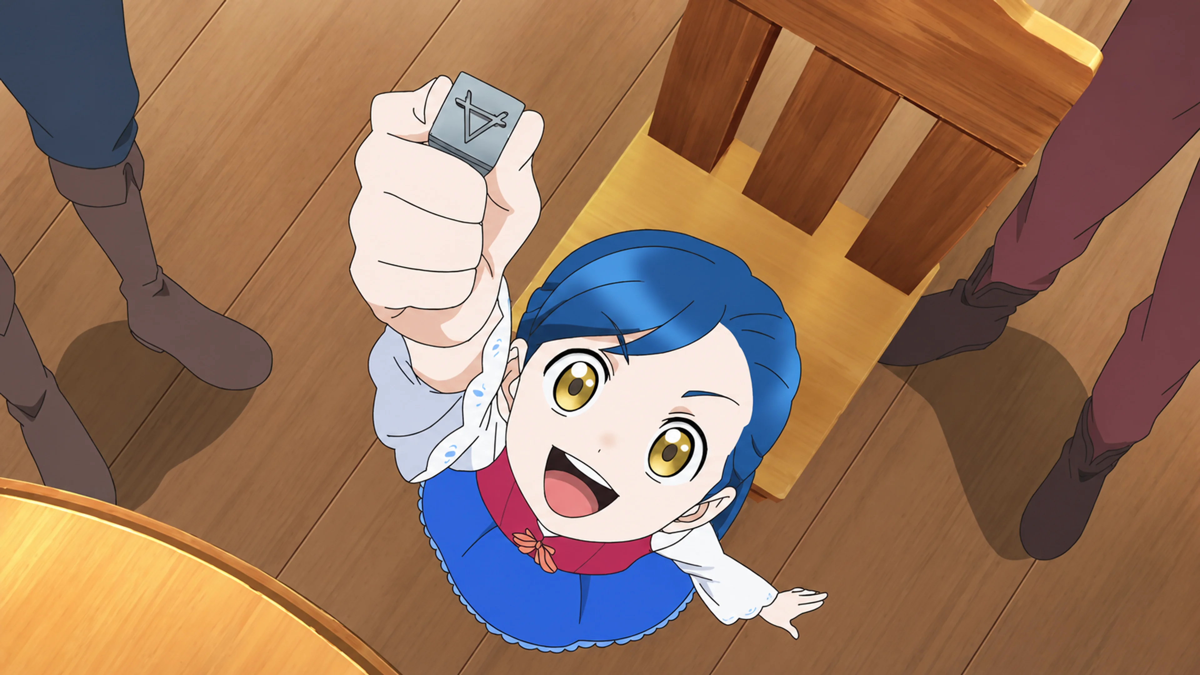 Myne holds up a small gray metal object marked with a triangle in an earlier anime episode.