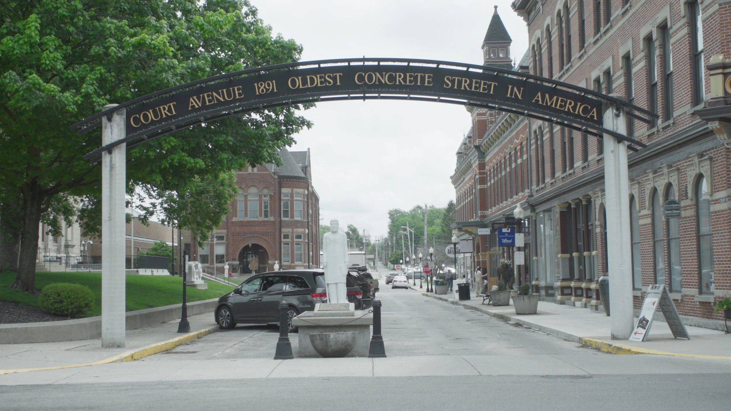 A roadside sign marks the oldest concrete street in America.