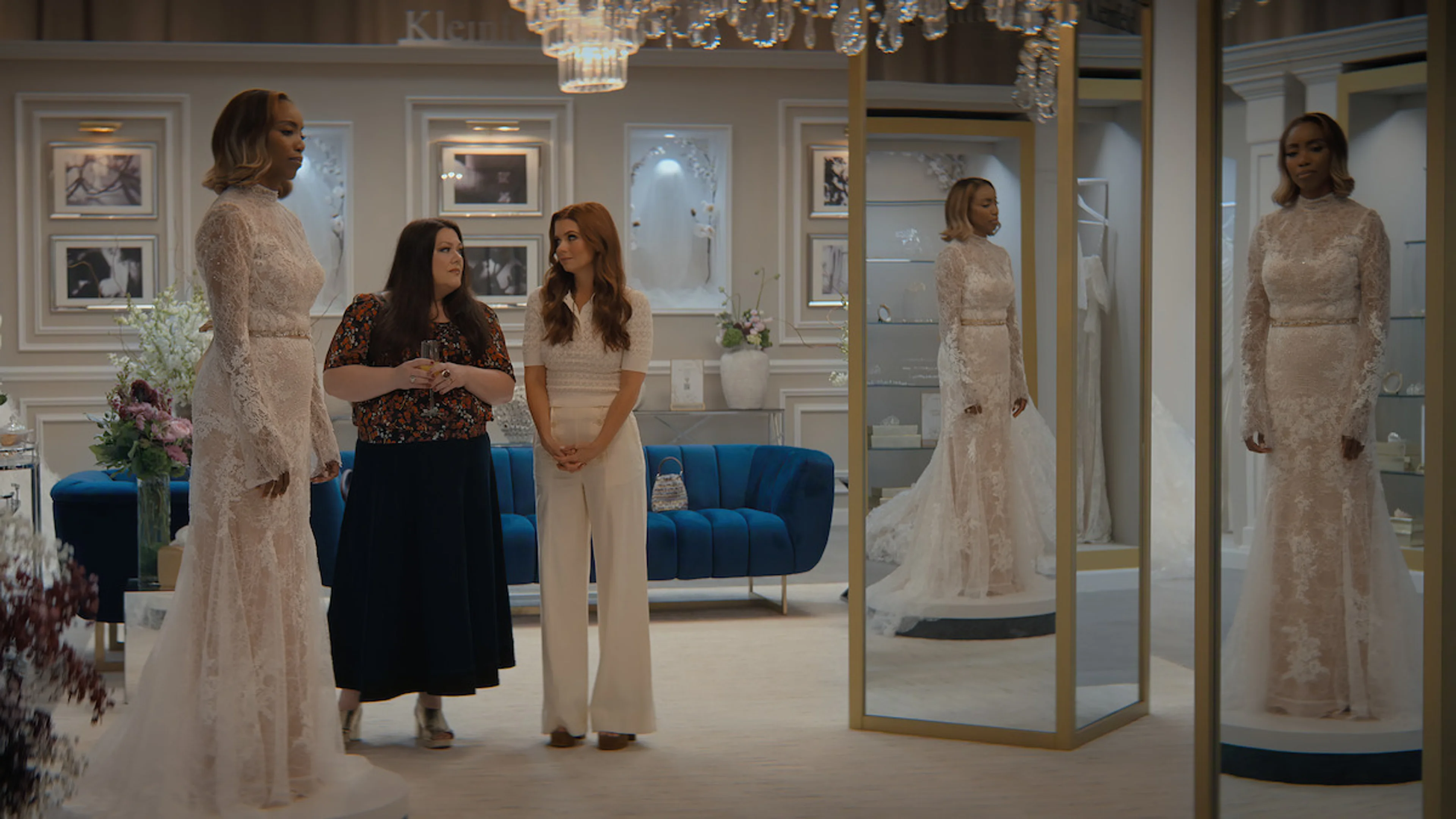 Heather Headley, Brooke Elliott, and JoAnna Garcia Swisher stand together in a bridal shop in Sweet Magnolias Season 5.