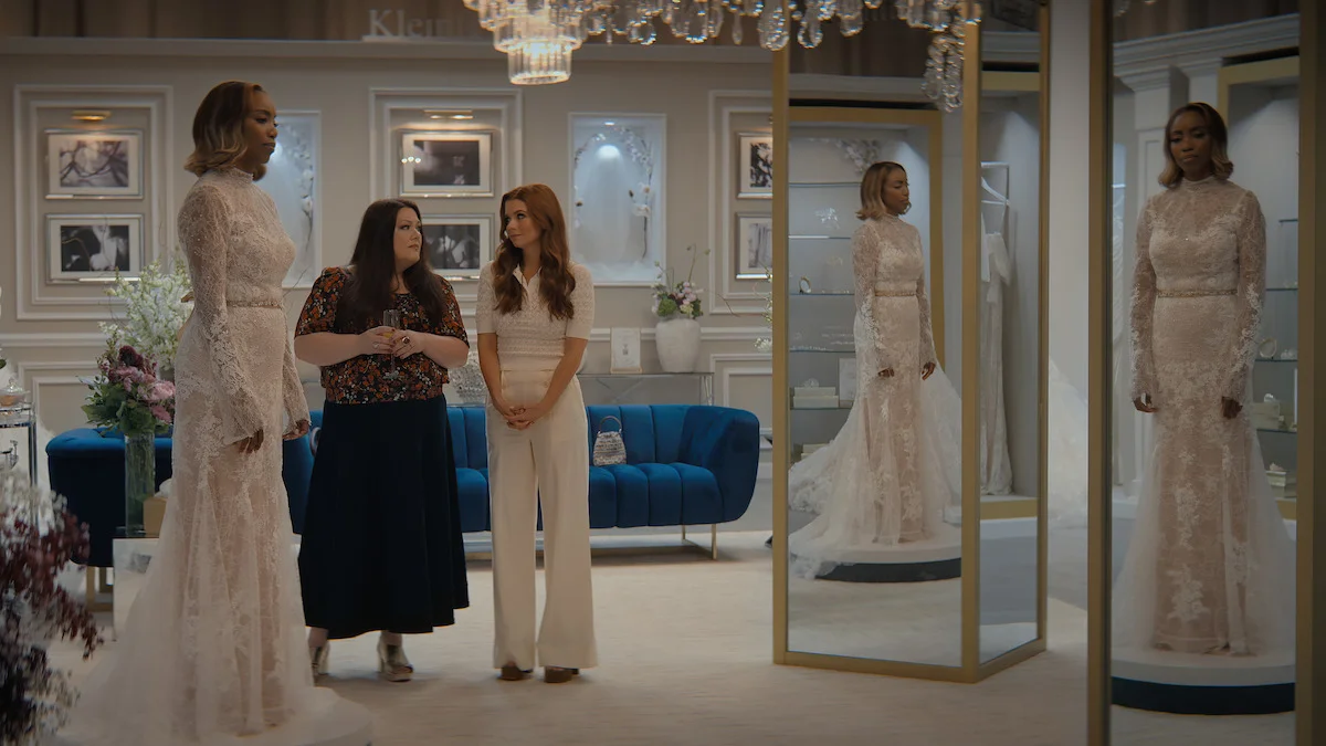 Heather Headley, Brooke Elliott, and JoAnna Garcia Swisher stand together in a bridal shop in Sweet Magnolias Season 5.