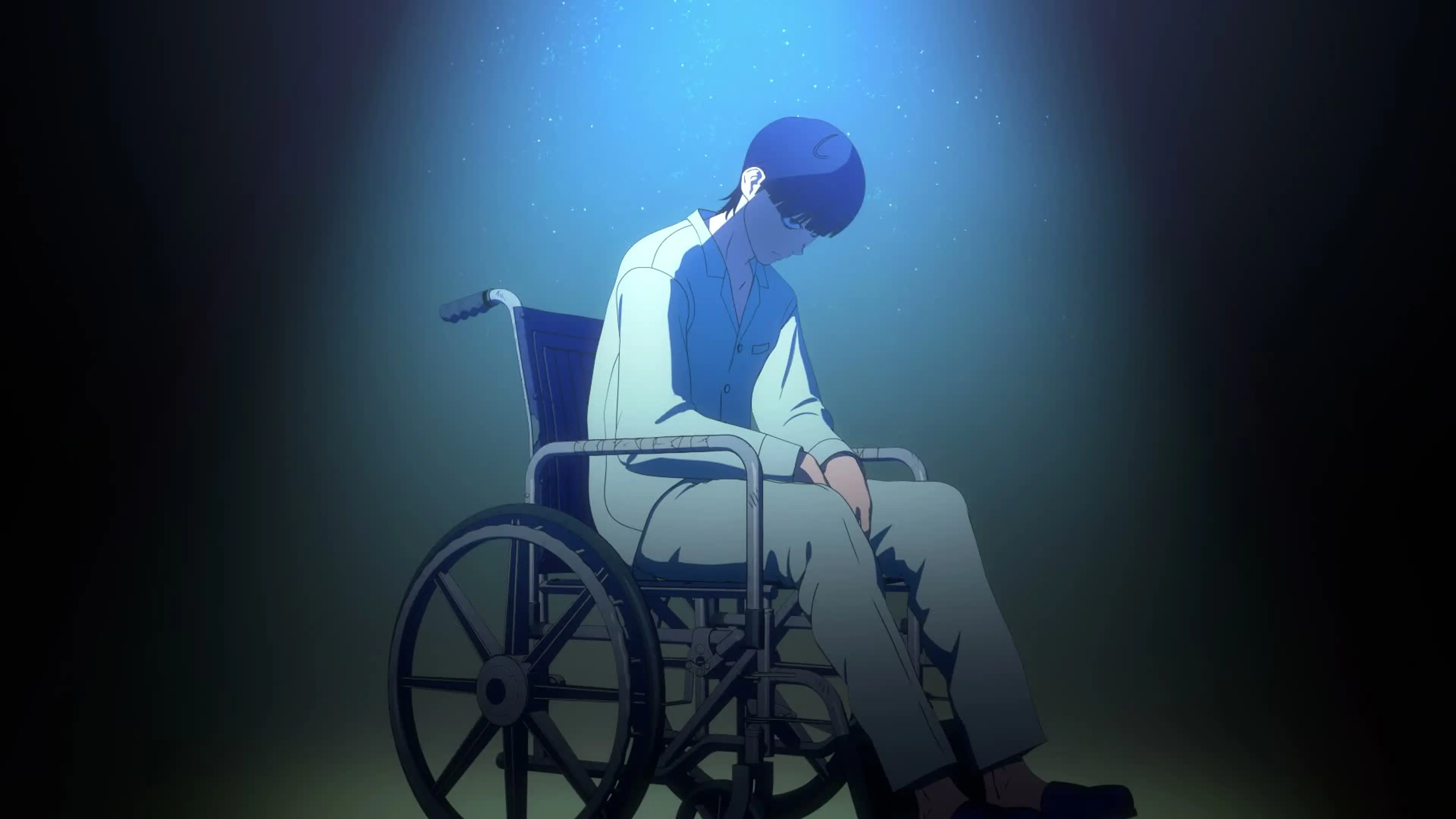 Nagi Taira sits under a blue spotlight in his wheelchair in the Tank Chair anime.
