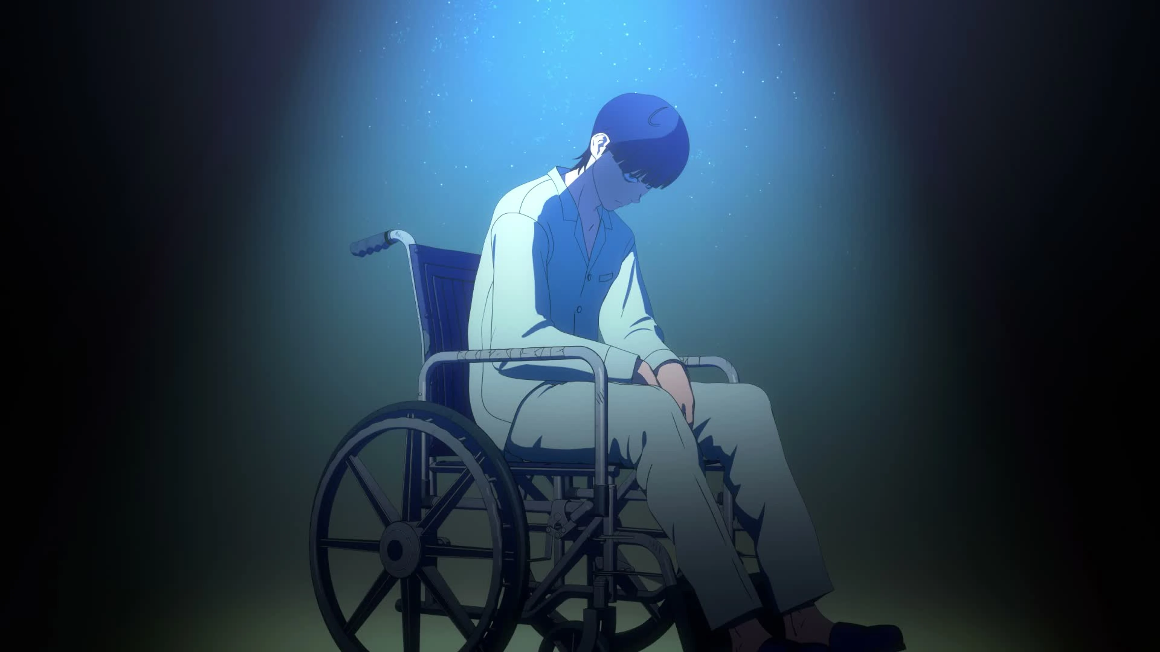 Nagi Taira sits under a blue spotlight in his wheelchair in the Tank Chair anime.