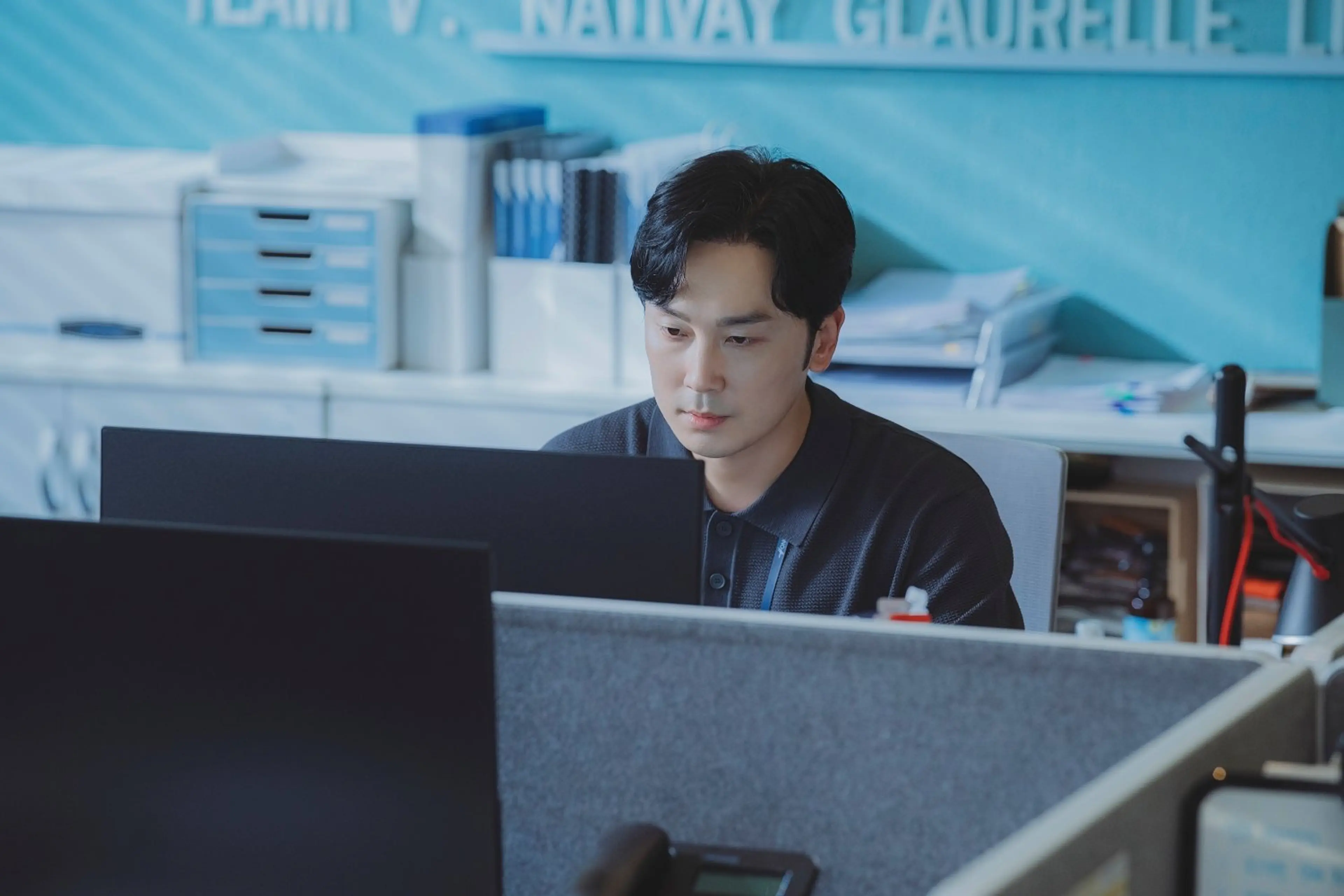 Yang Jun-ho sits at his computer in the office.