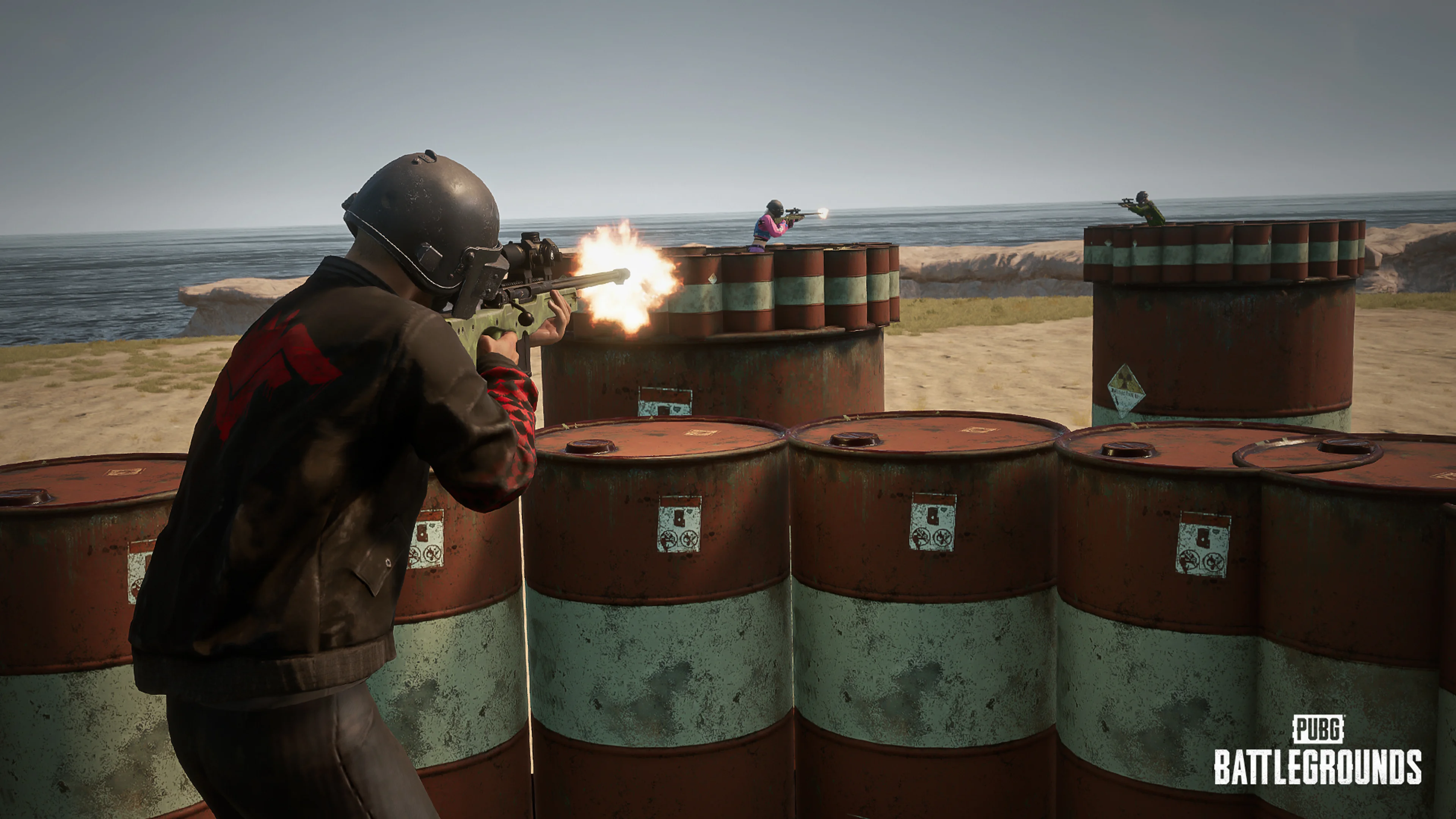 PUBG player firing across a custom arena made from rows of barrels.