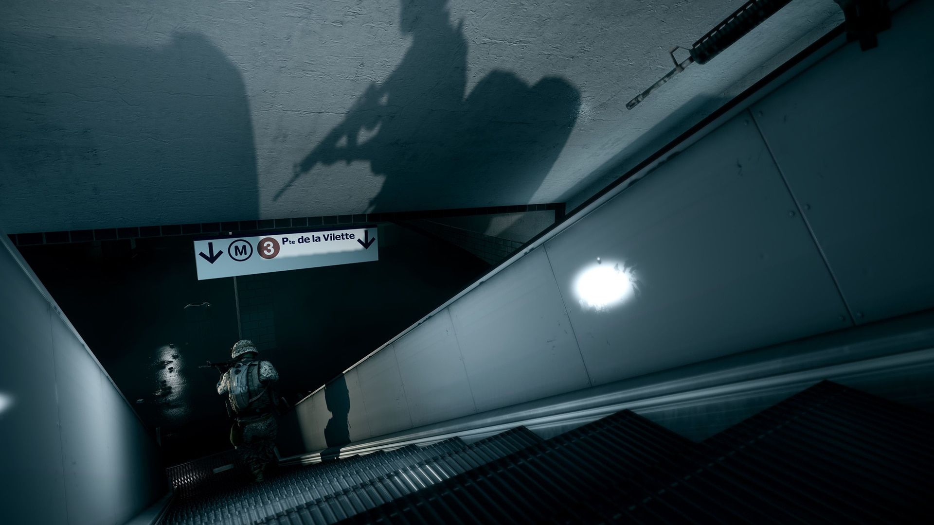 Two armed figures descend a subway escalator beneath a large soldier's shadow.