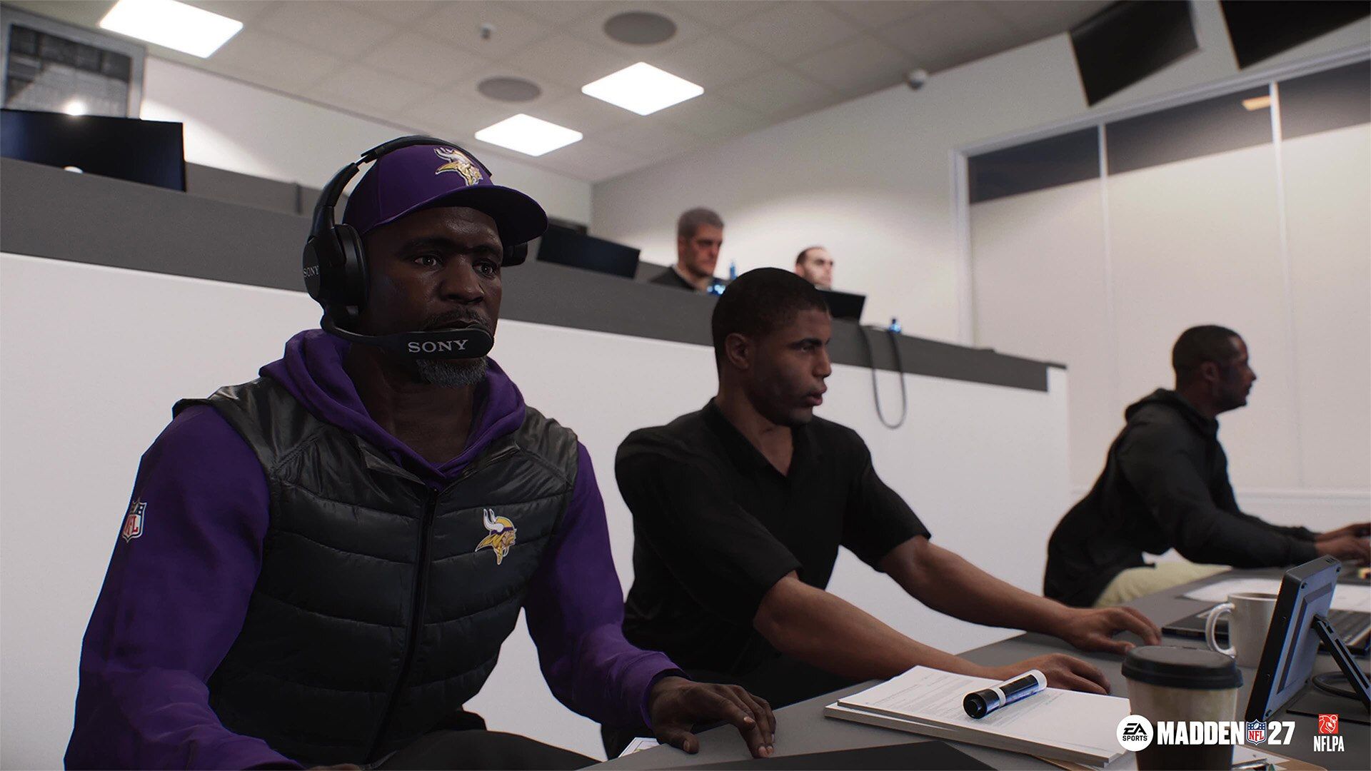 Minnesota Vikings coaches coordinate from a coaching booth in Madden NFL 27 Franchise Mode.