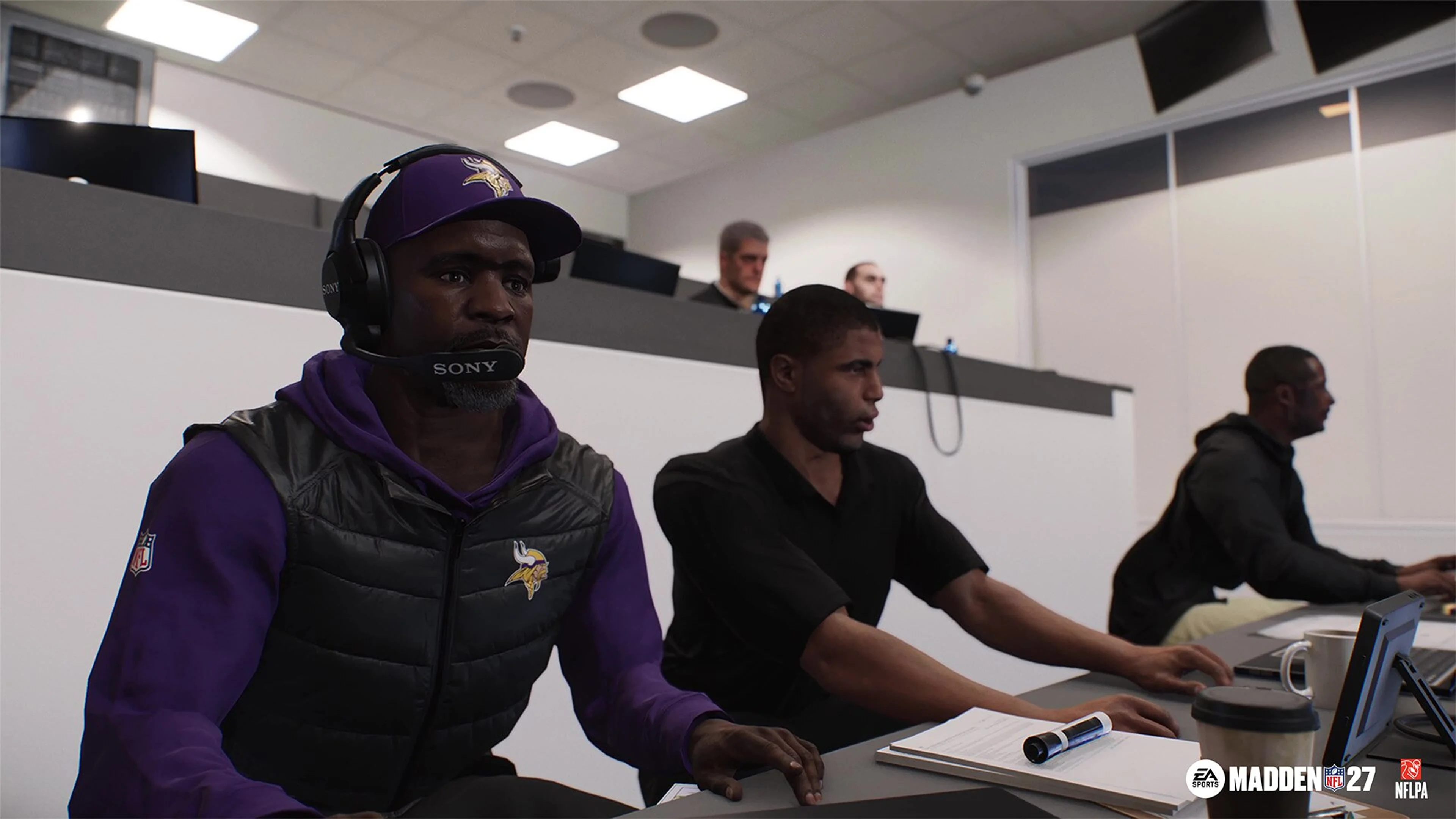 Minnesota Vikings coaches coordinate from a coaching booth in Madden NFL 27 Franchise Mode.