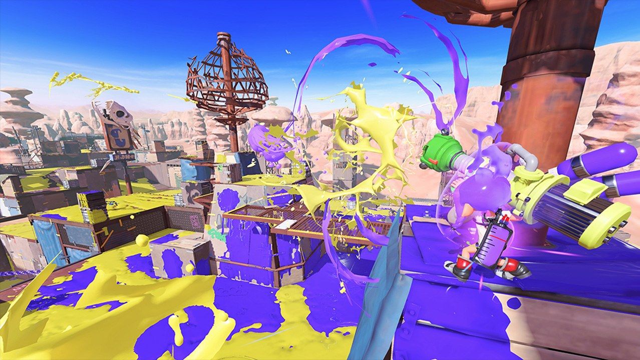 Players spread purple and yellow ink in a Turf War match.