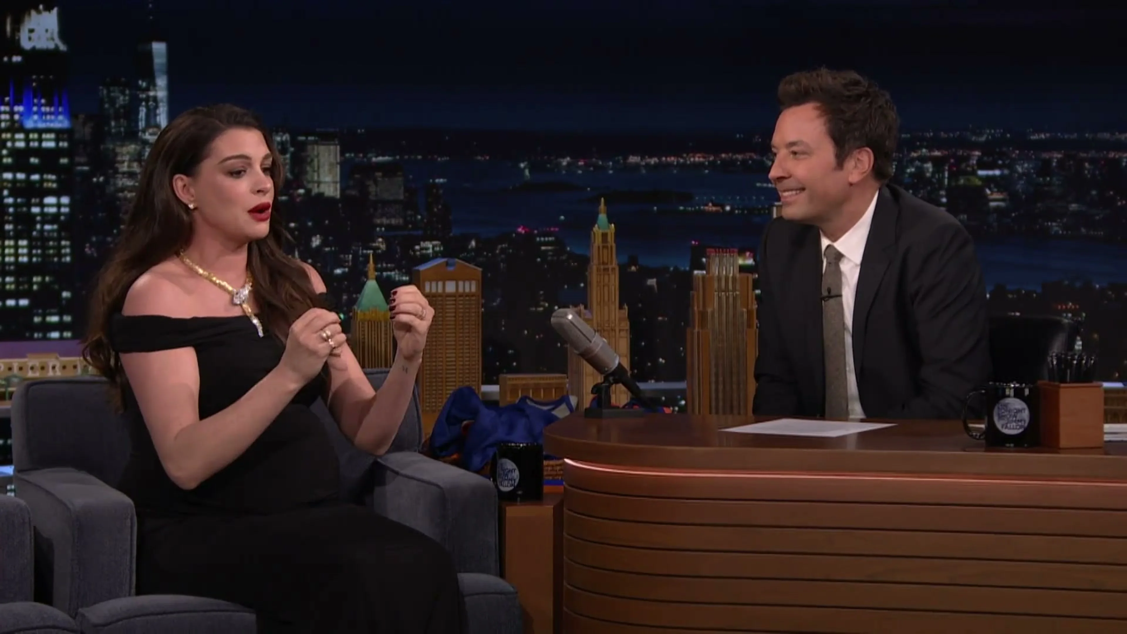 Anne Hathaway explains her reaction while Jimmy Fallon listens on The Tonight Show.