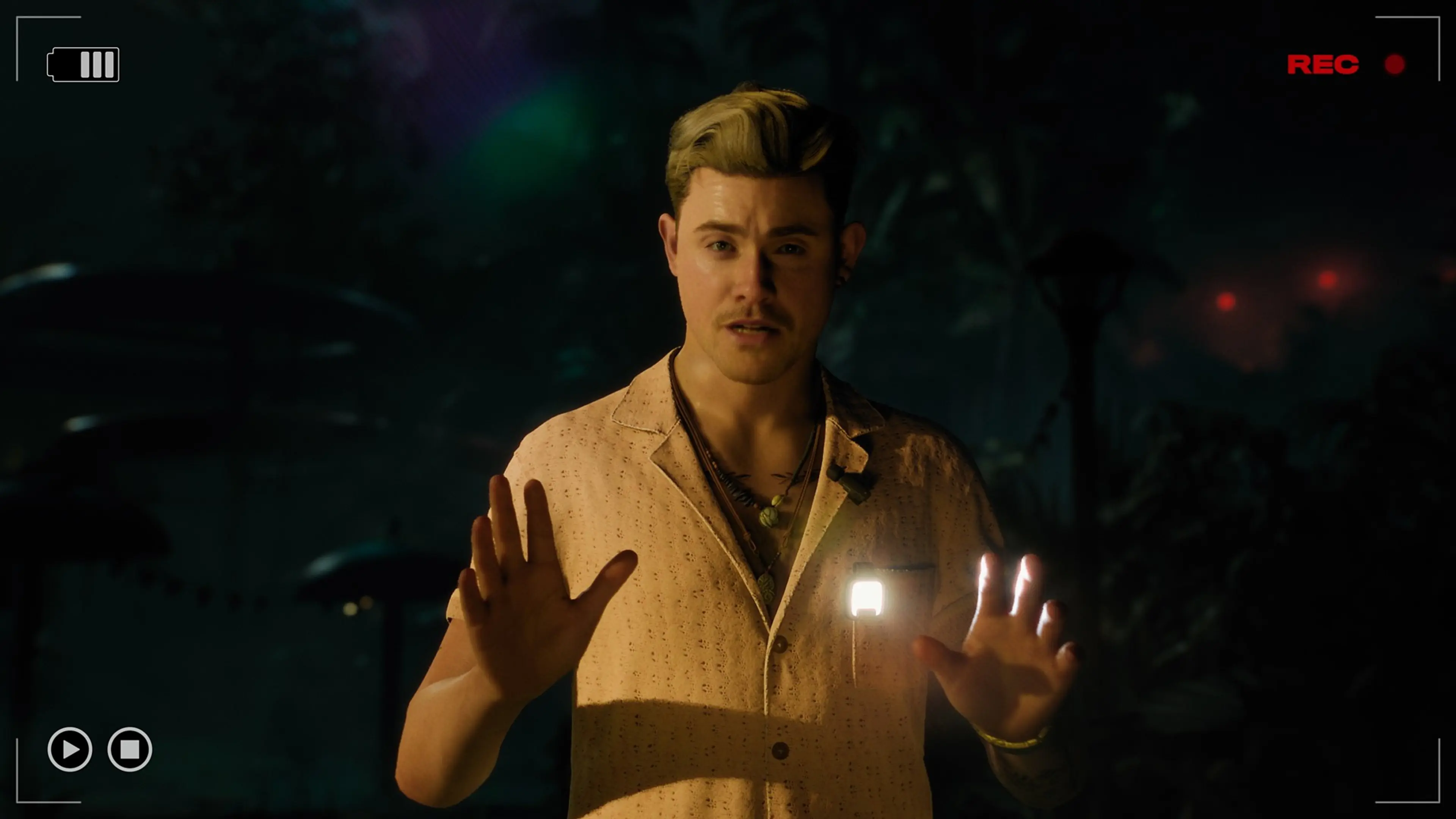 A Dead True crew member stands in front of a video camera during an Until Dawn 2 investigation.
