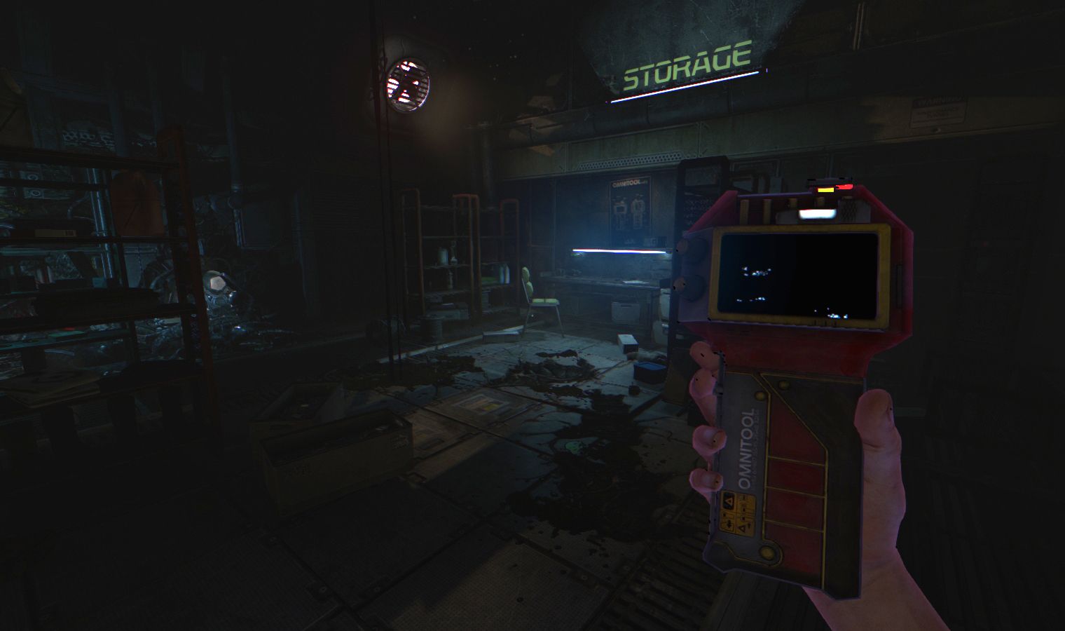 A handheld scanner or device is held in front of a storage doorway.