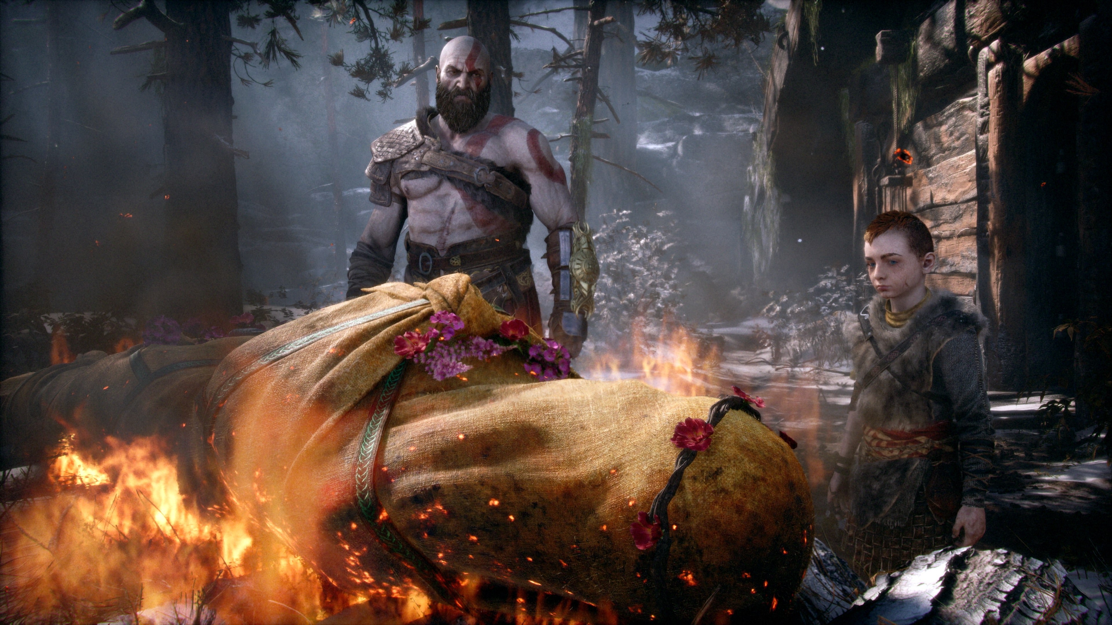 Kratos and Atreus stand beside Faye's funeral pyre in a scene connected to God of War's Norse story.
