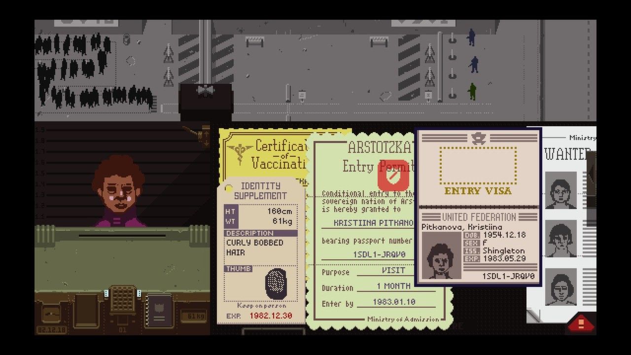 Three documents and a bulletin are spread across the desk.