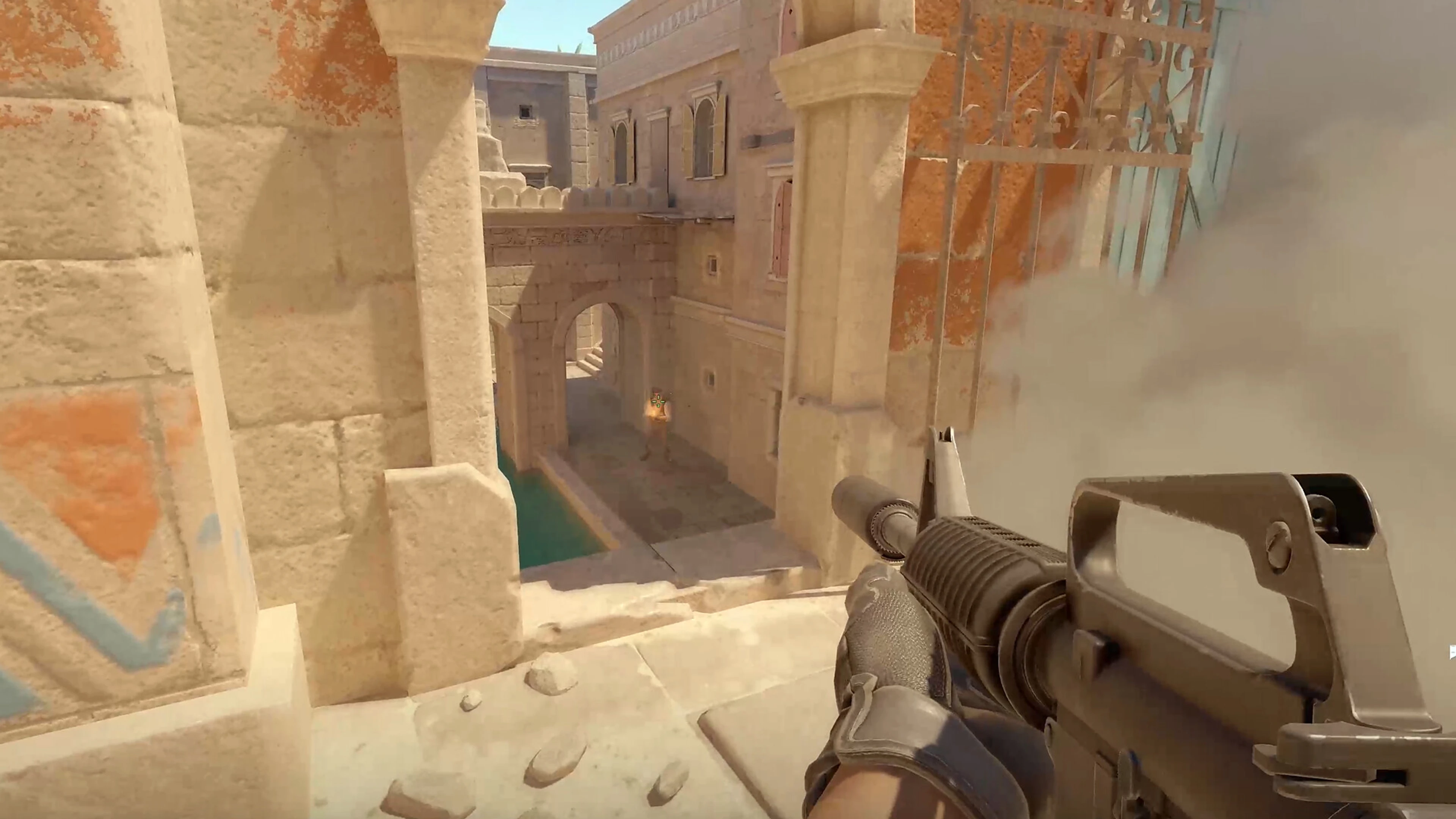 A Counter-Terrorist aims down a stone corridor beside a smoke cloud in Counter-Strike 2.