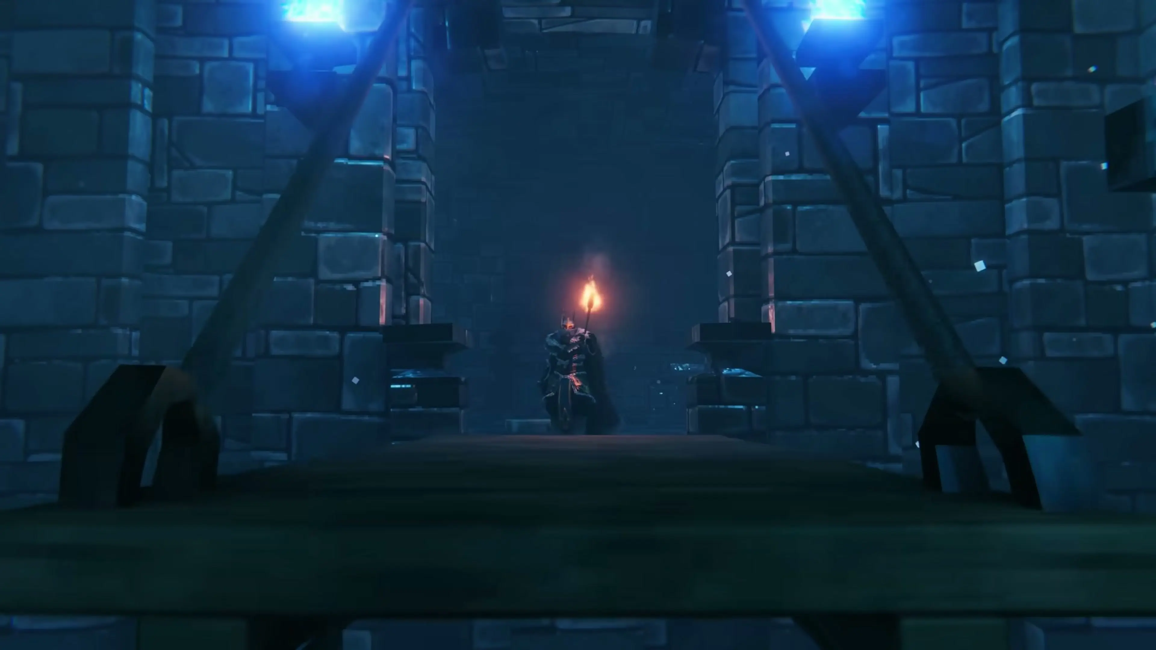 An armored Viking carrying a torch enters a blue-lit stone fortress in Valheim’s Deep North.
