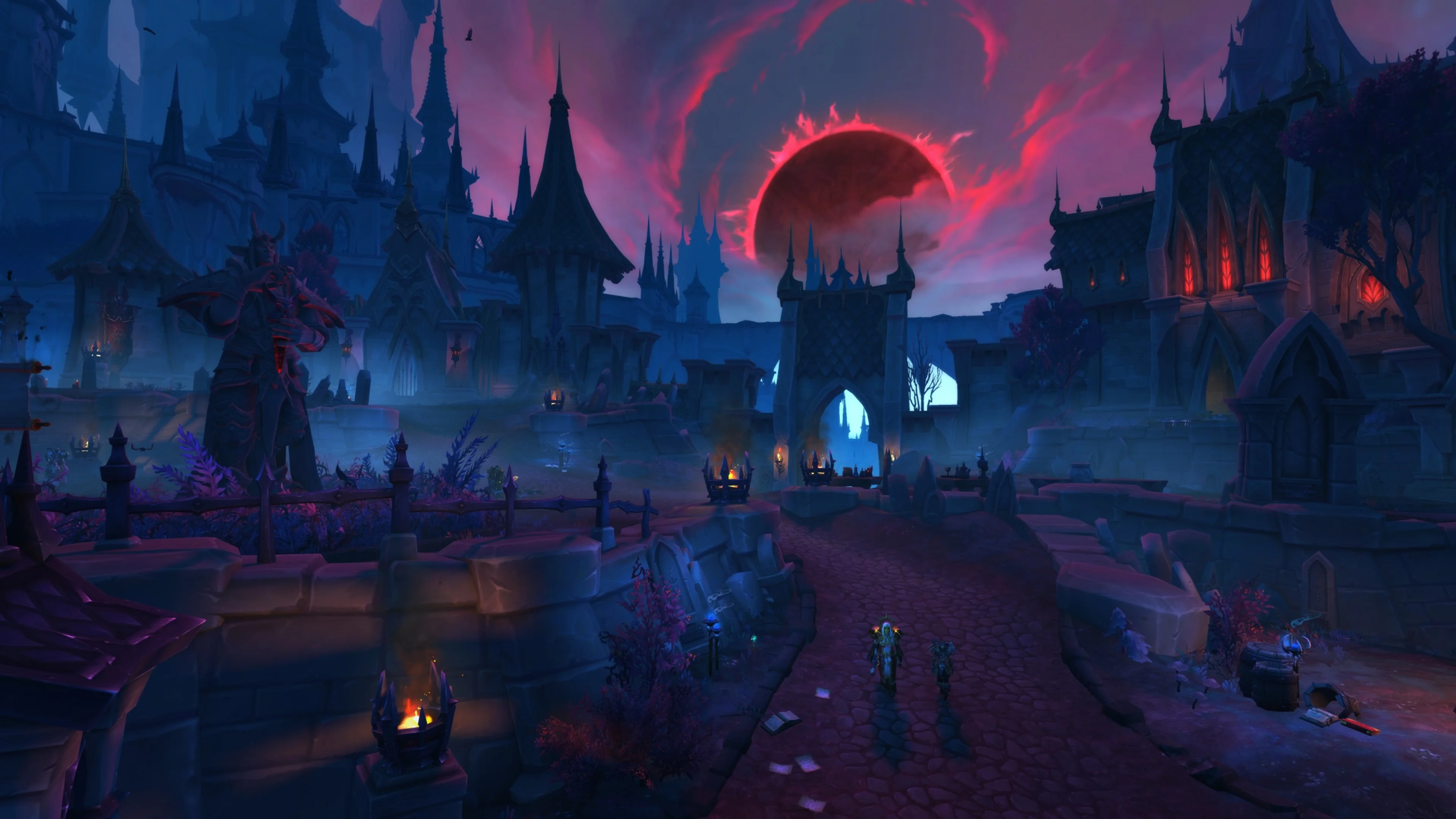 Players enter a ruined Talebound settlement beneath a large red moon while enemies wait ahead.