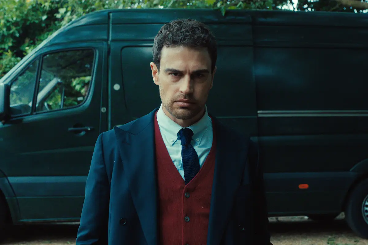 Theo James as Eddie Horniman stands in front of a black van during The Gentlemen Season 2 finale.