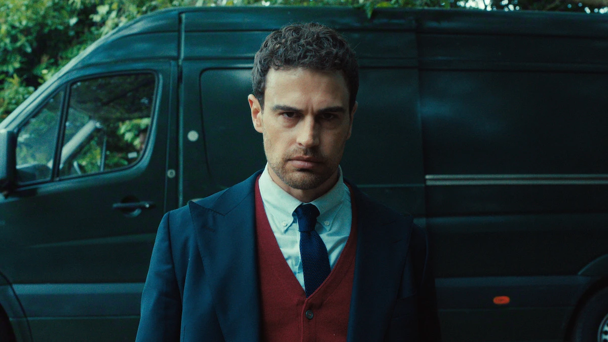 Theo James as Eddie Horniman stands in front of a black van during The Gentlemen Season 2 finale.