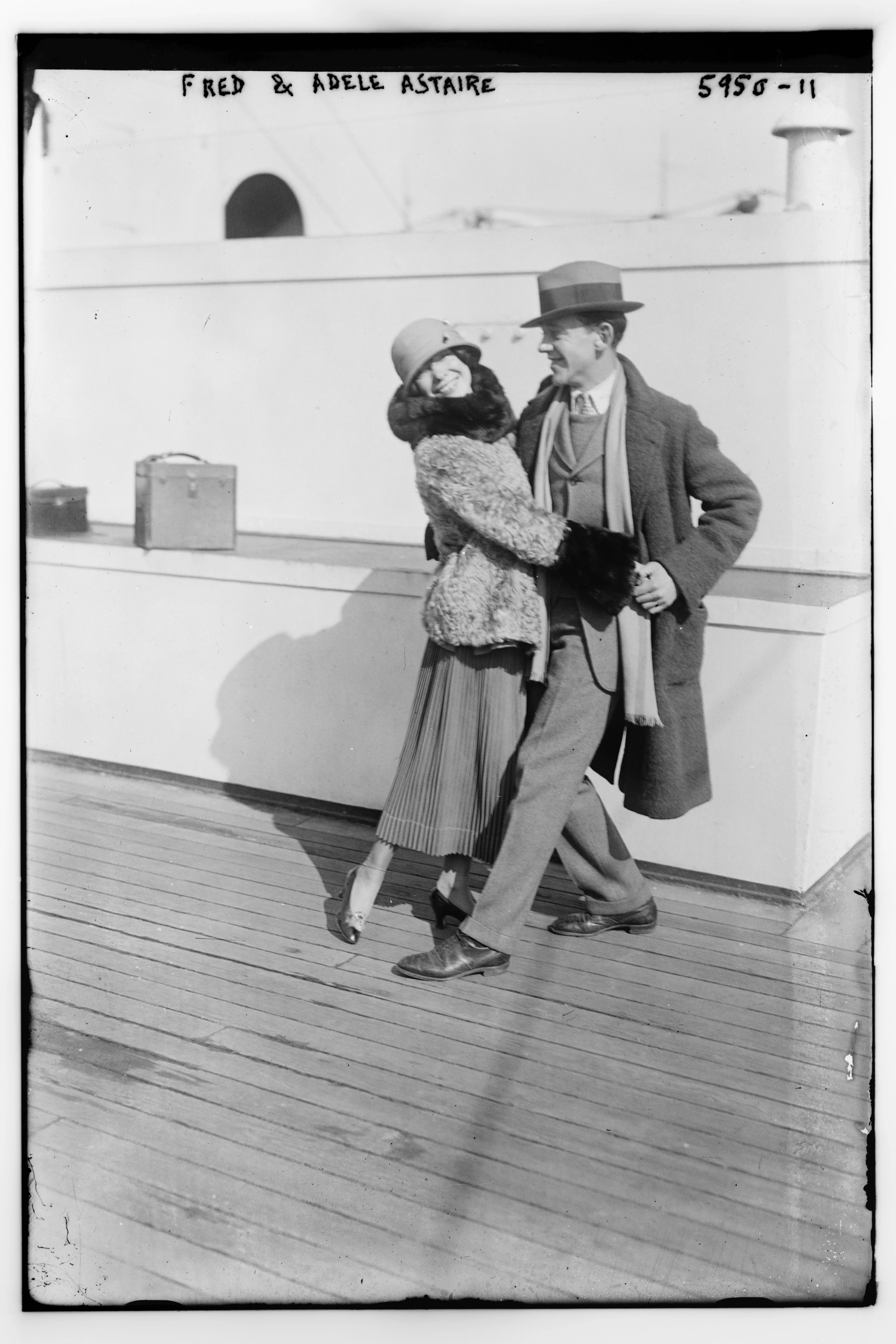 Archival black-and-white photograph of Fred and Adele Astaire posing together on a ship deck.