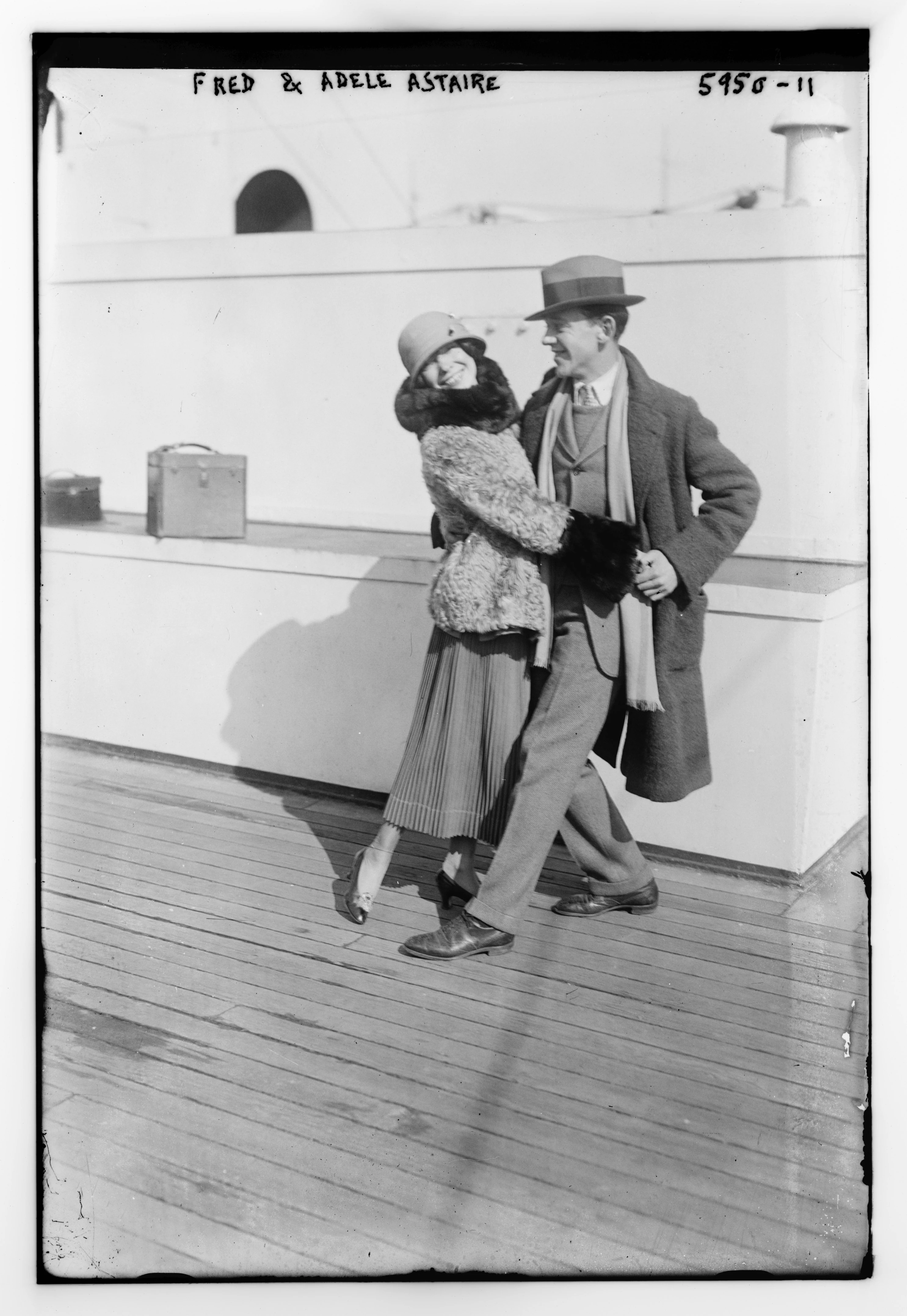 Archival black-and-white photograph of Fred and Adele Astaire posing together on a ship deck.