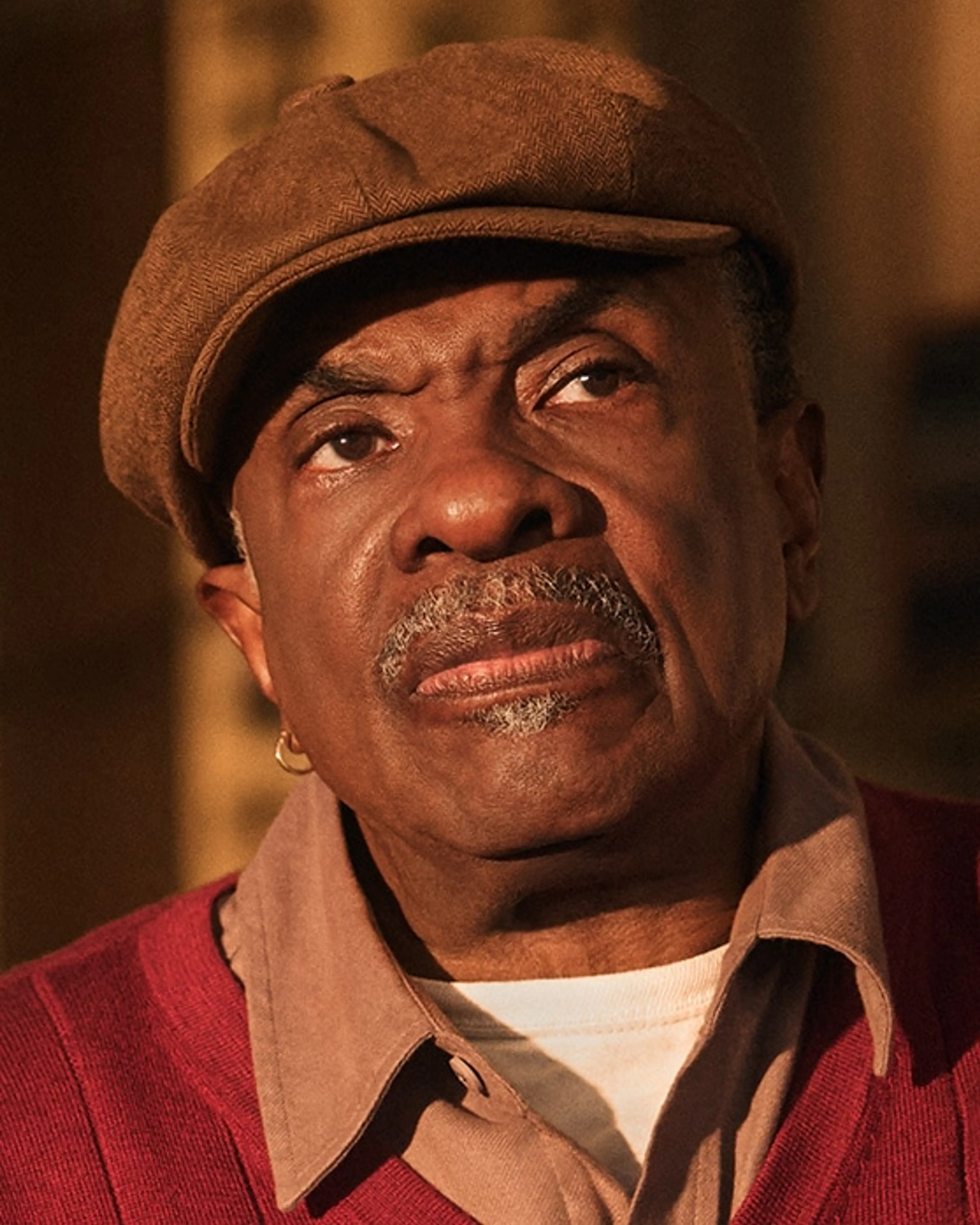 Keith David wears Marty’s cap and red cardigan.