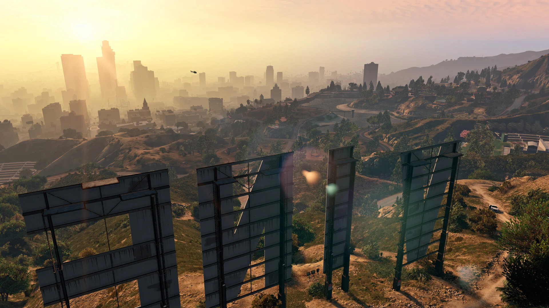 A wide view from behind the Vinewood sign across Los Santos in GTA 5.