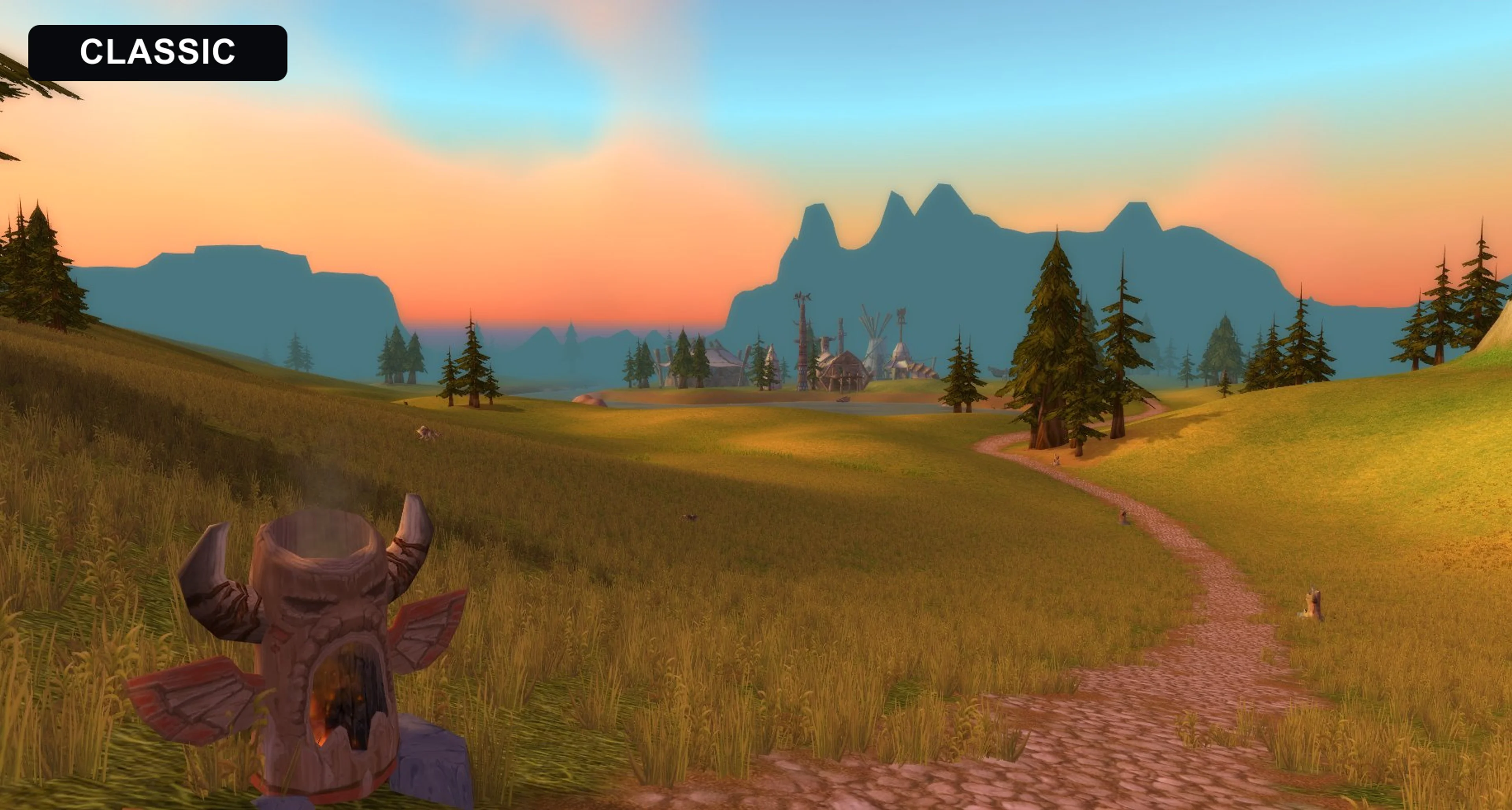 A World of Warcraft Classic landscape at sunset with distant terrain shown as dark silhouettes.
