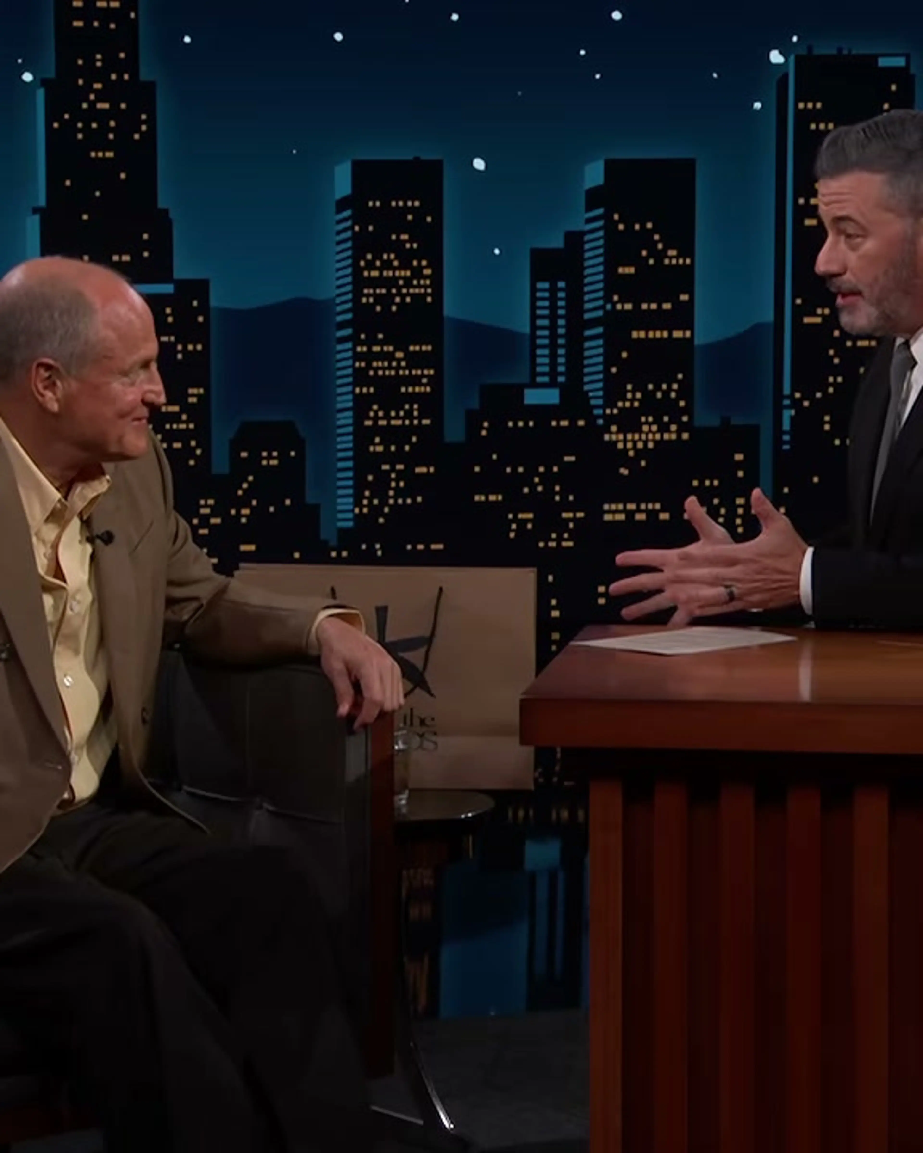 Jimmy Kimmel gestures toward Woody Harrelson while telling the Emmys story.