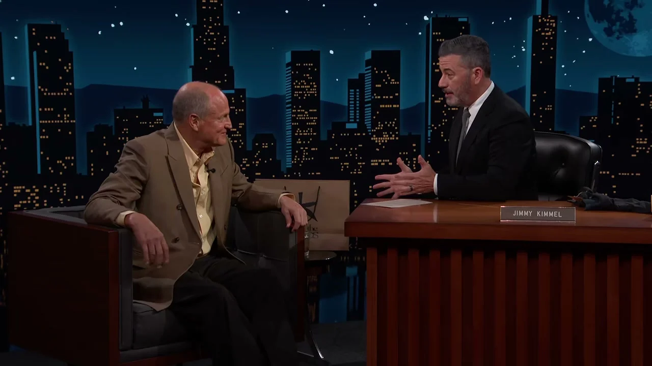 Jimmy Kimmel gestures toward Woody Harrelson while telling the Emmys story.