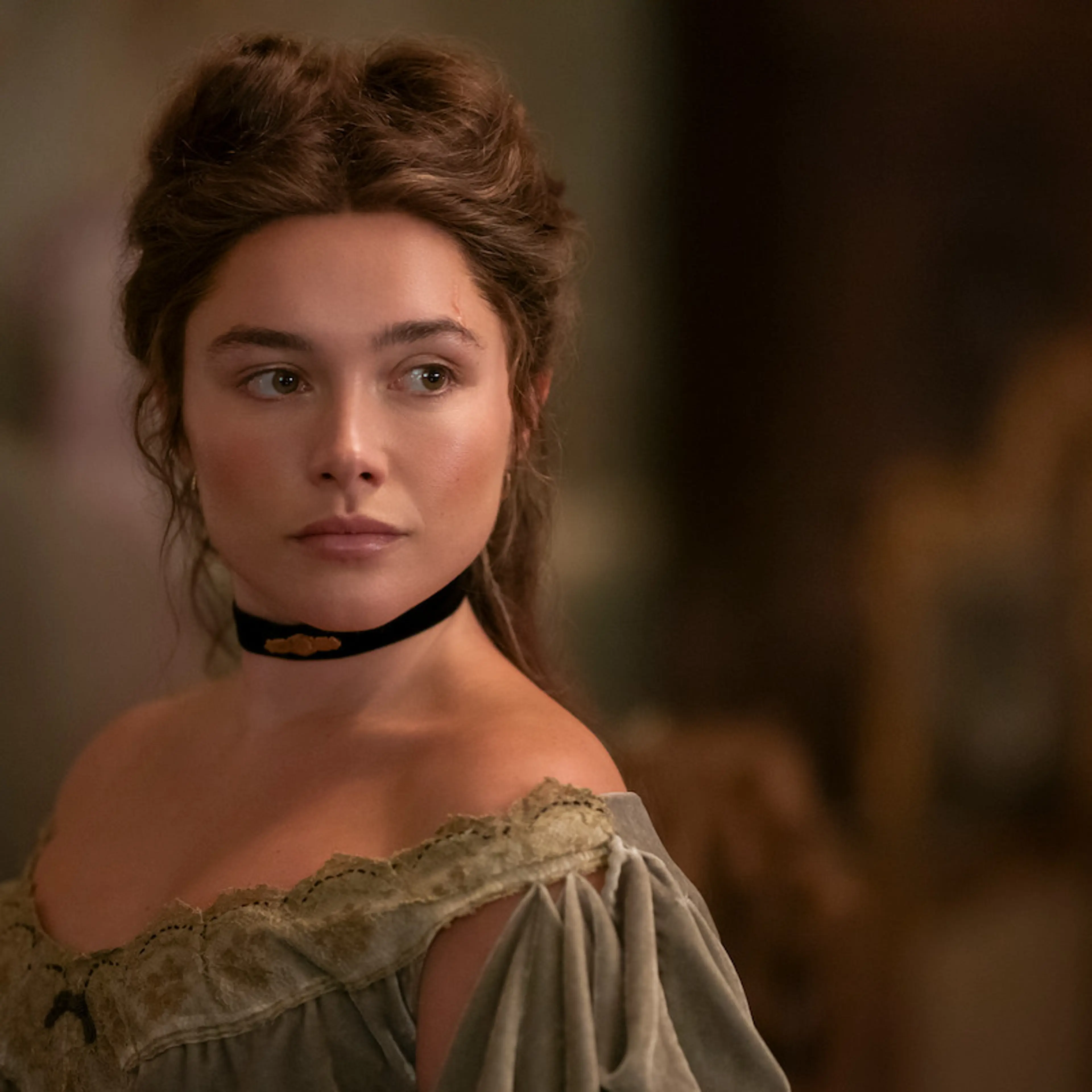 Florence Pugh as Cathy Ames wears a black choker and period dress in East of Eden.