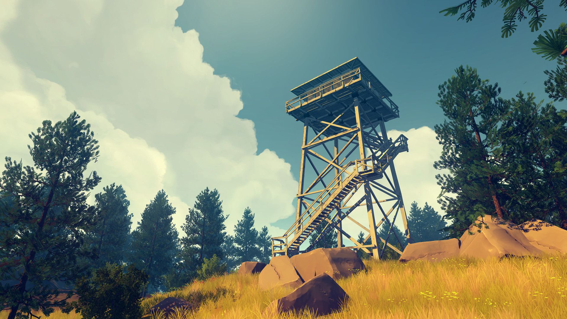 A fire lookout tower stands above a wooded slope.