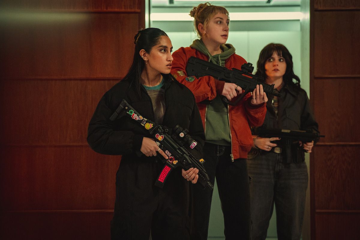 Three armed characters in a scene from Black Doves Season 2.