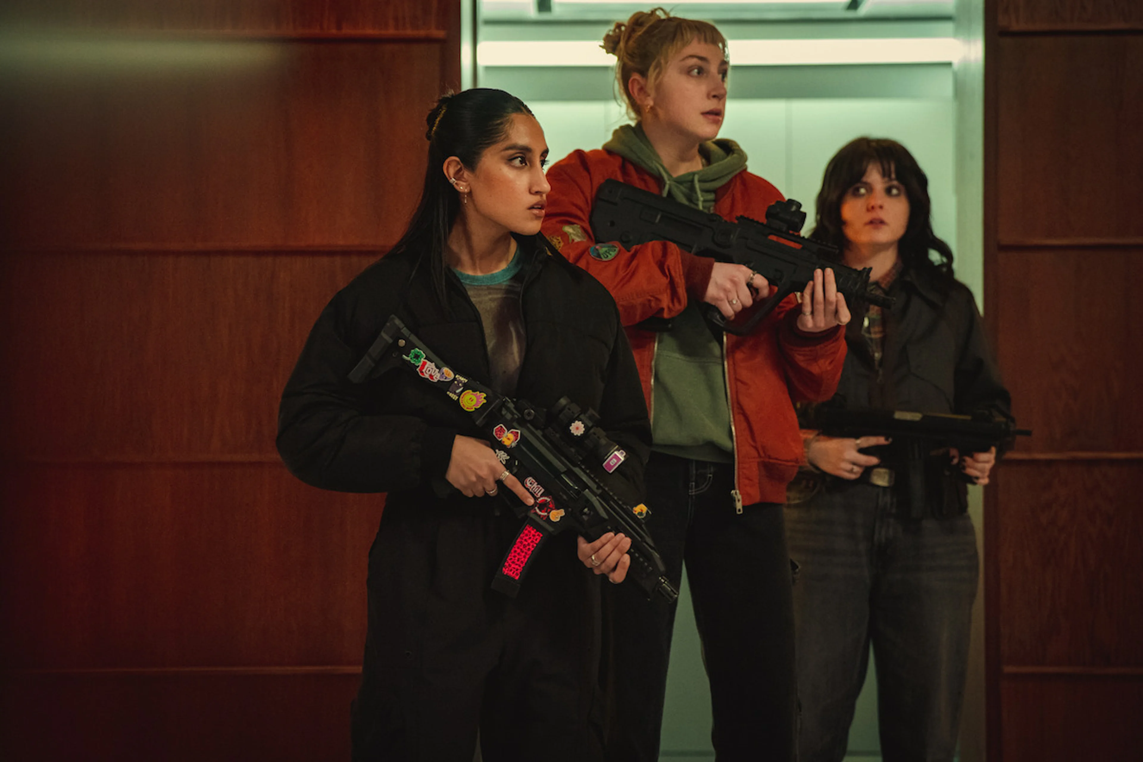 Three armed characters in a scene from Black Doves Season 2.