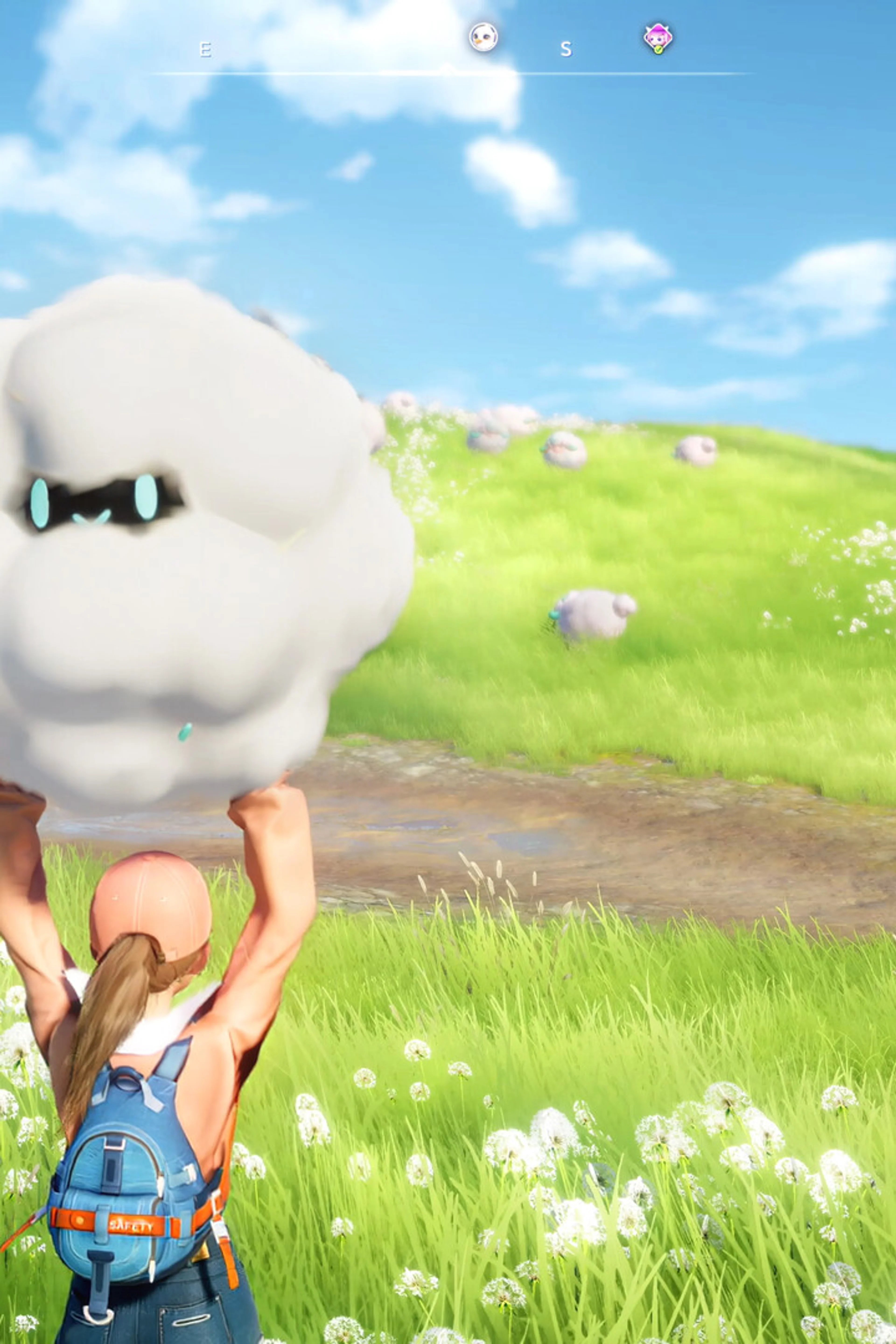 A Pathfinder holding a fluffy Aniimo in a flower-covered field.