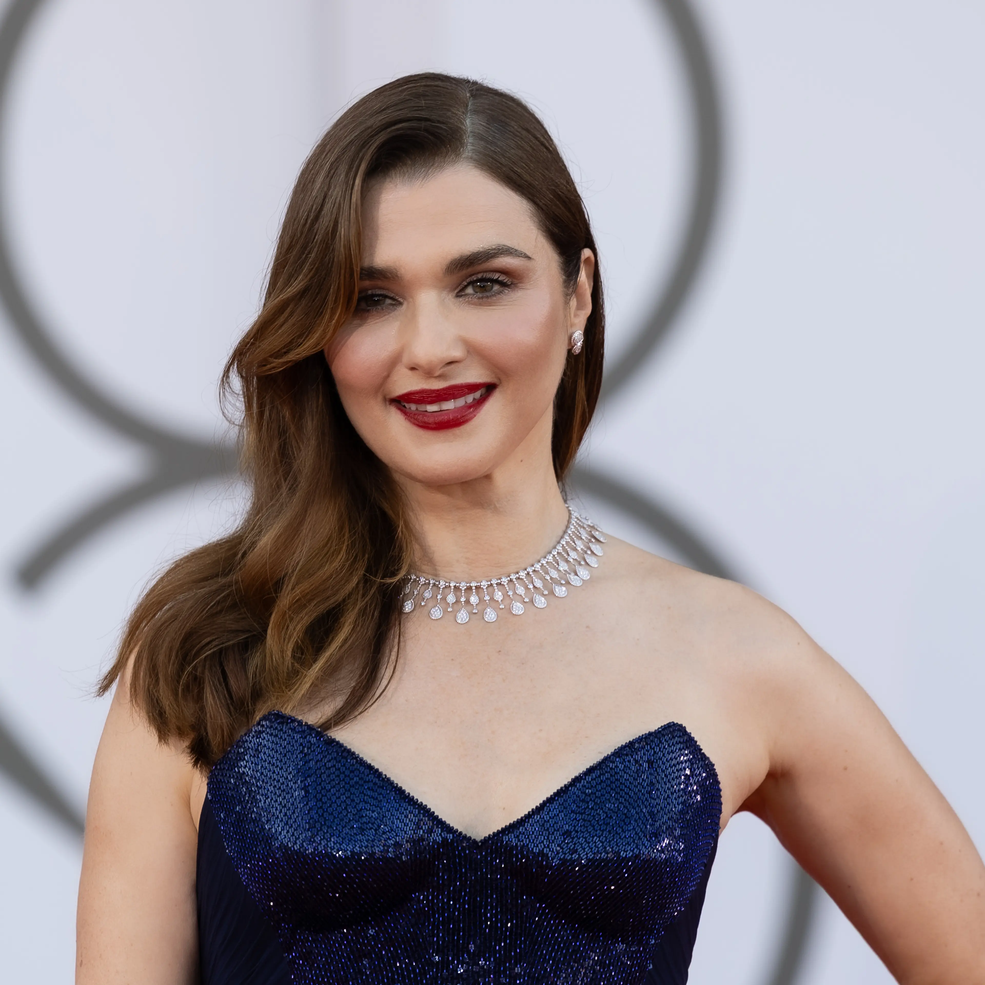 Rachel Weisz wears a dark blue dress at the 2024 Venice Film Festival.